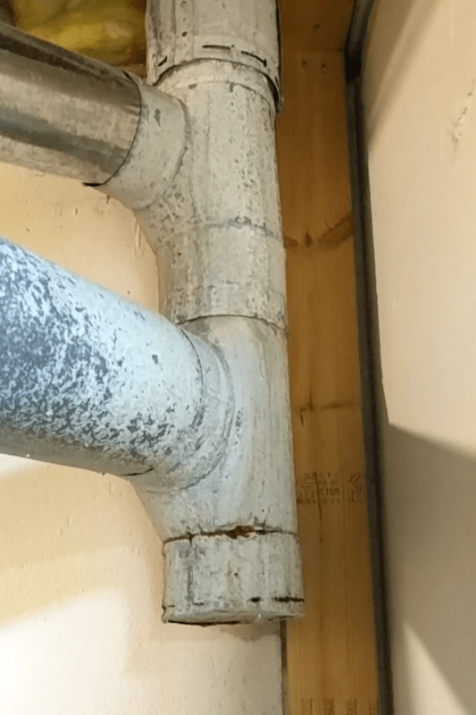 Which professional should I call for leak coming down the furnace