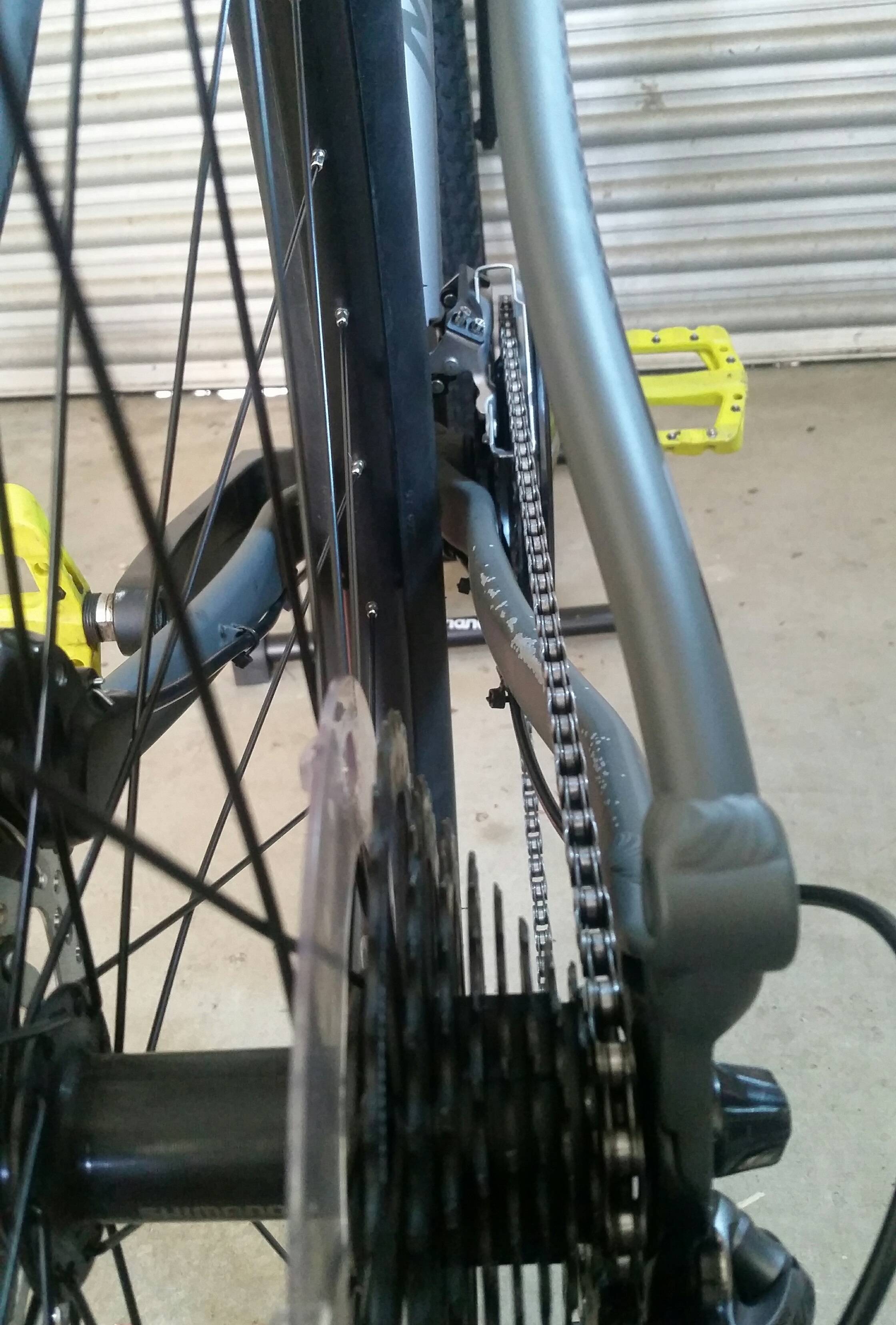 [SOLVED] Chain hitting front derailleur cage with H limit screw fully