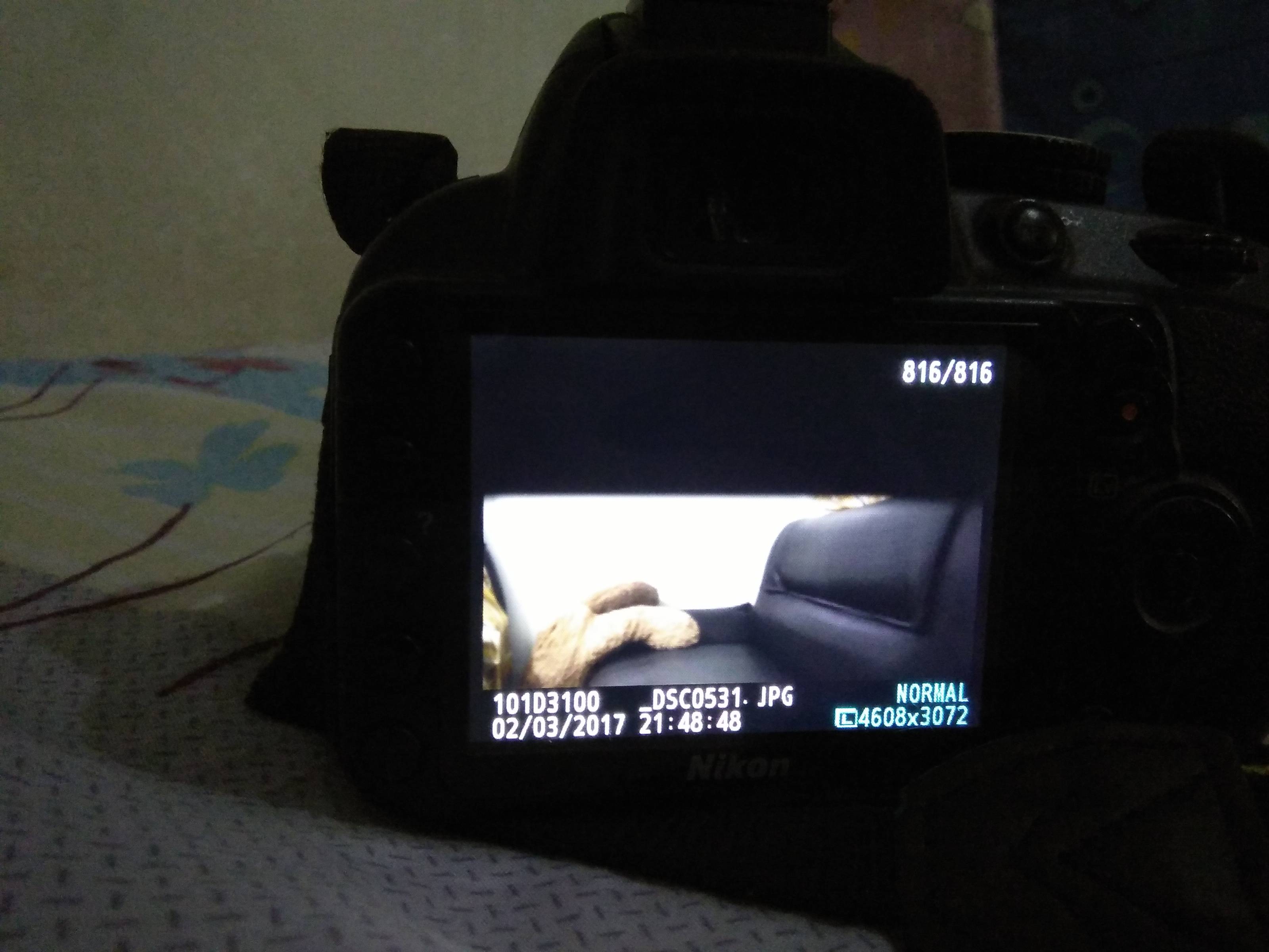nikon My DSLR takes photographs with black strip on top Photography