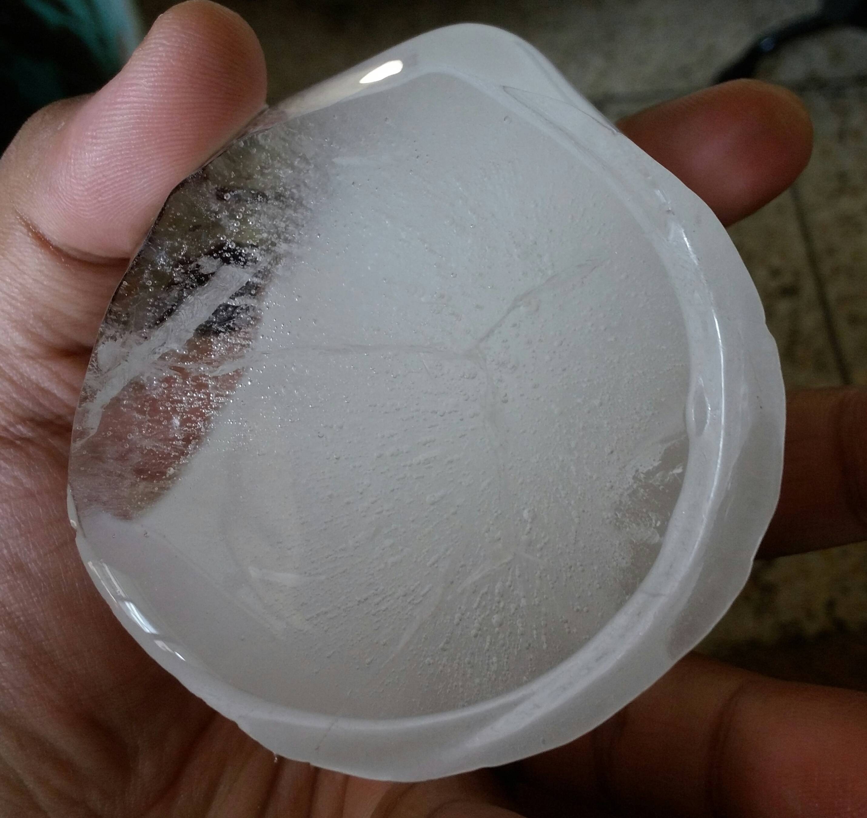 everyday life Why are some parts of this ice block cloudy and other