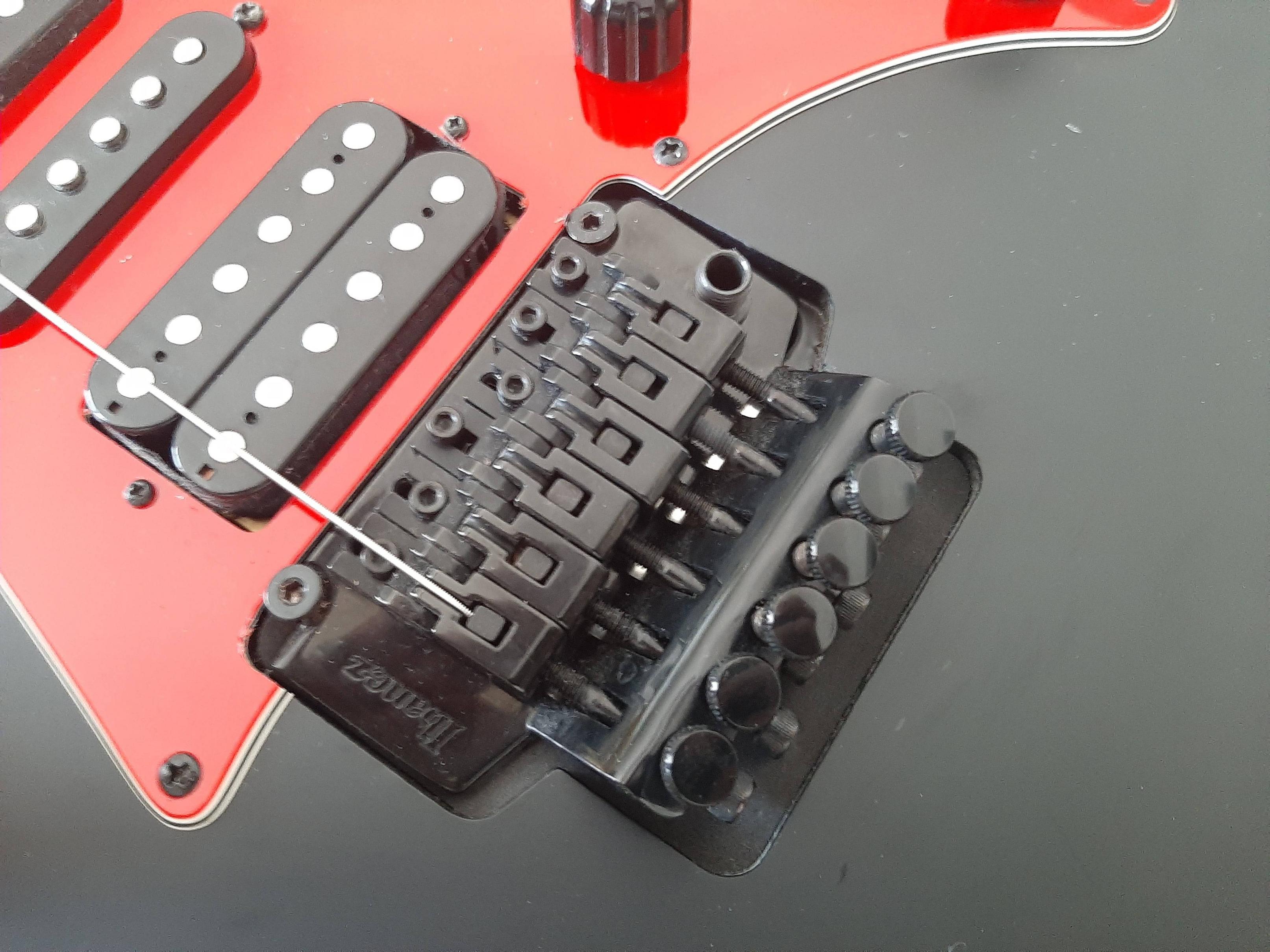 tuning Install new strings on guitar with whammy bar Music