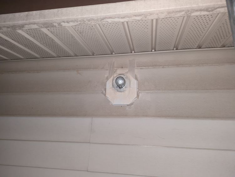 Mounting a pipe railing flange on vinyl siding in limited space Home