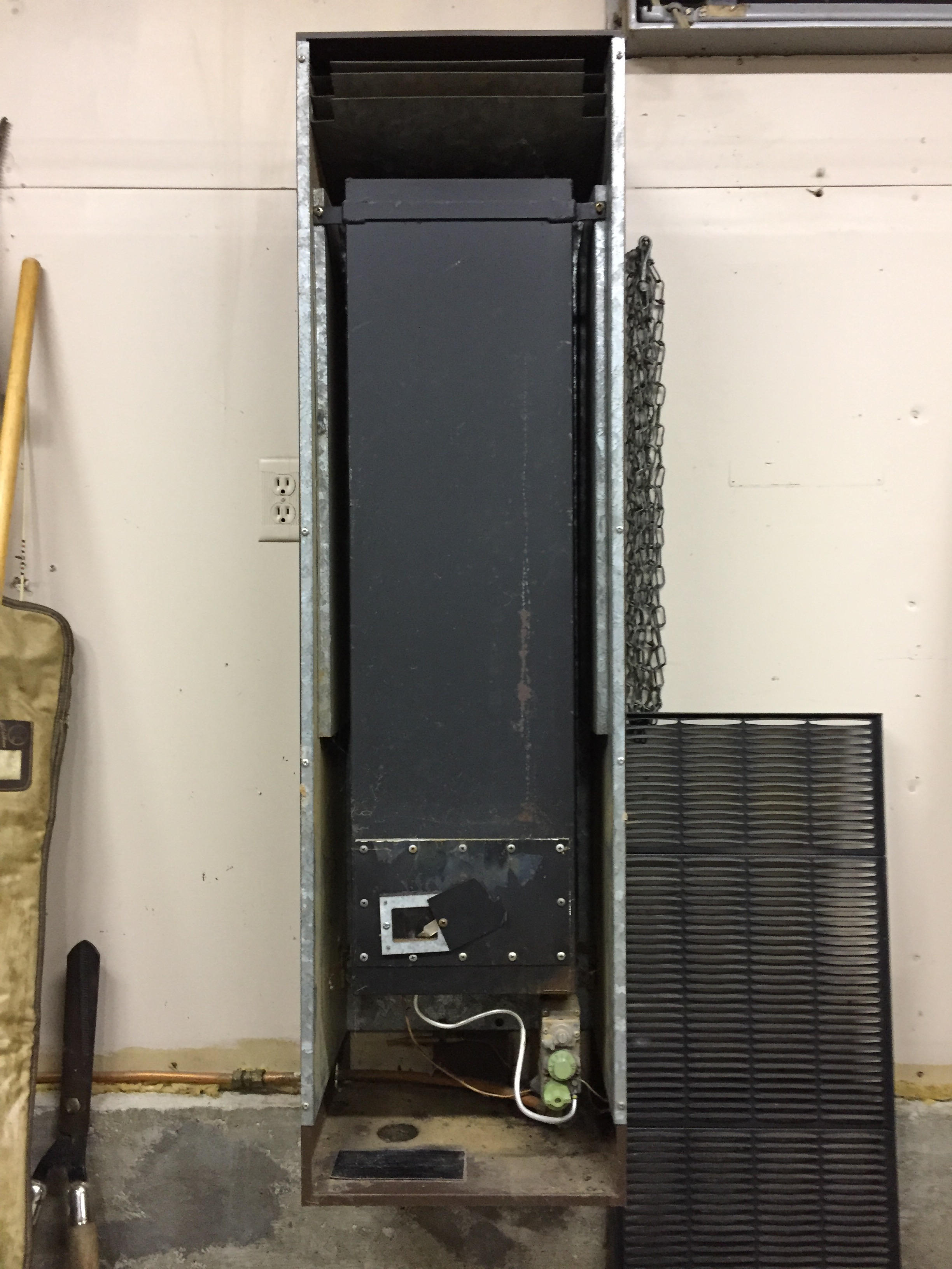 What method to use when cleaning an old wallmounted garage heater
