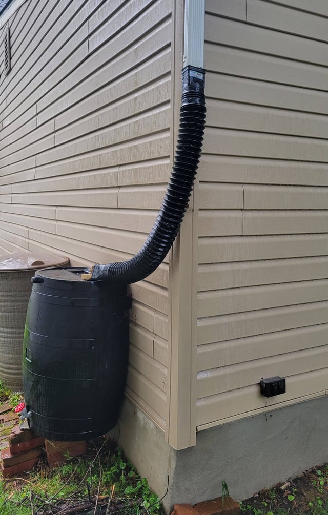 gutters How can I wrap a downspout around a corner into a rain barrel