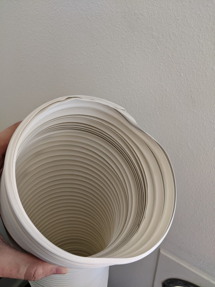 air conditioning How to fit portable air conditioner hoses through a