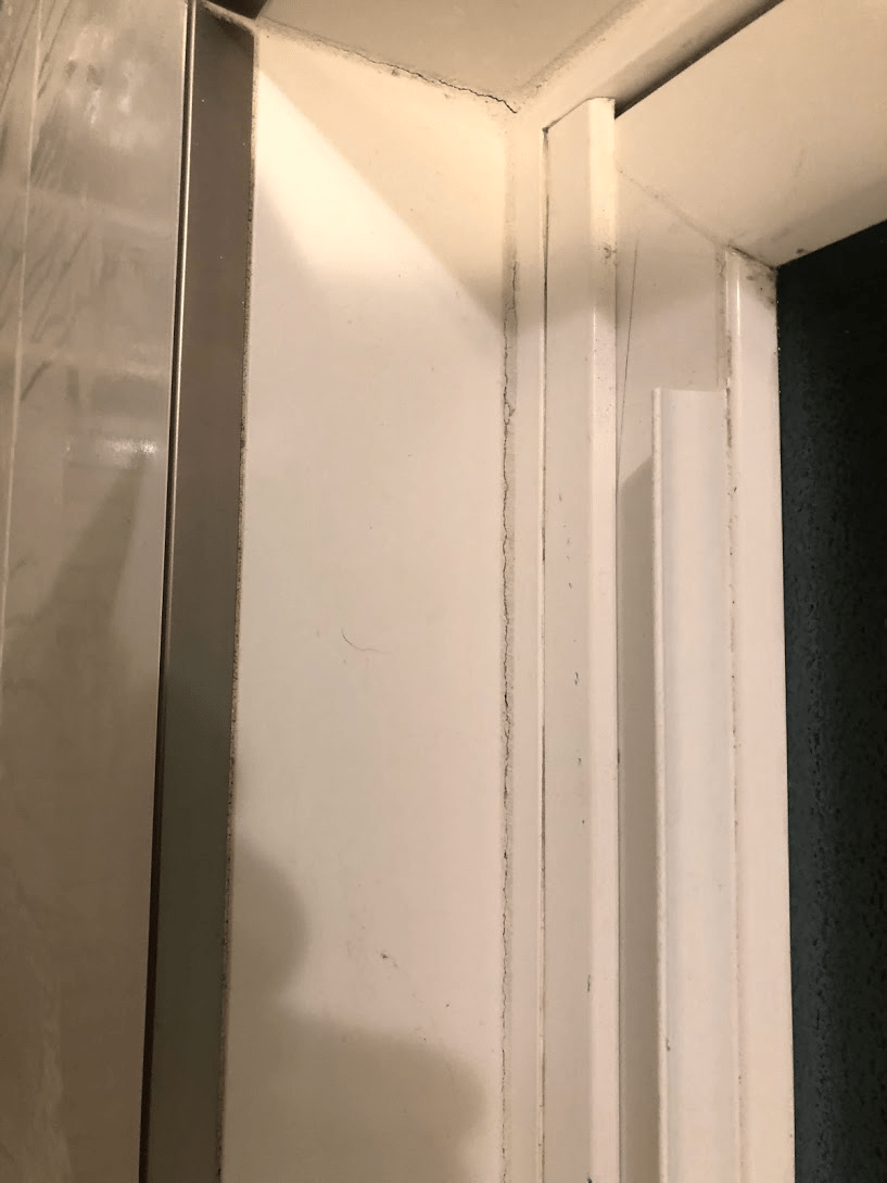 shower How can I fix hairline cracks in brand new grout? Home