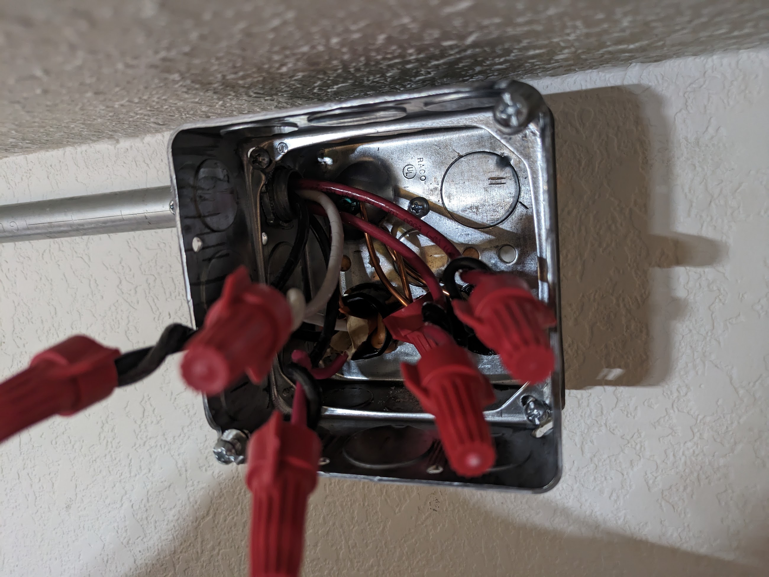 Electrical box extension on a box on top of a wall only to satisfy box