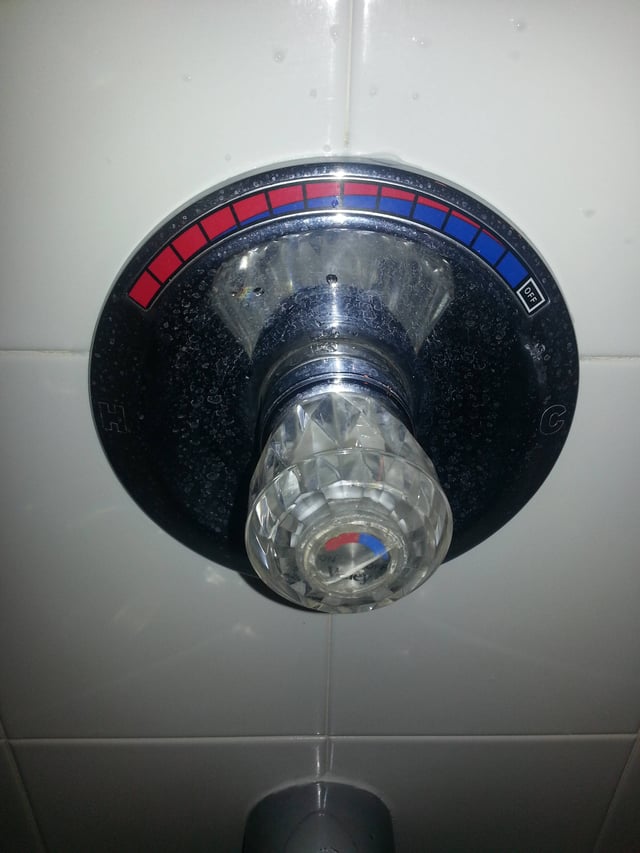How do I fix a shower mixer so I get hot water without turning the knob