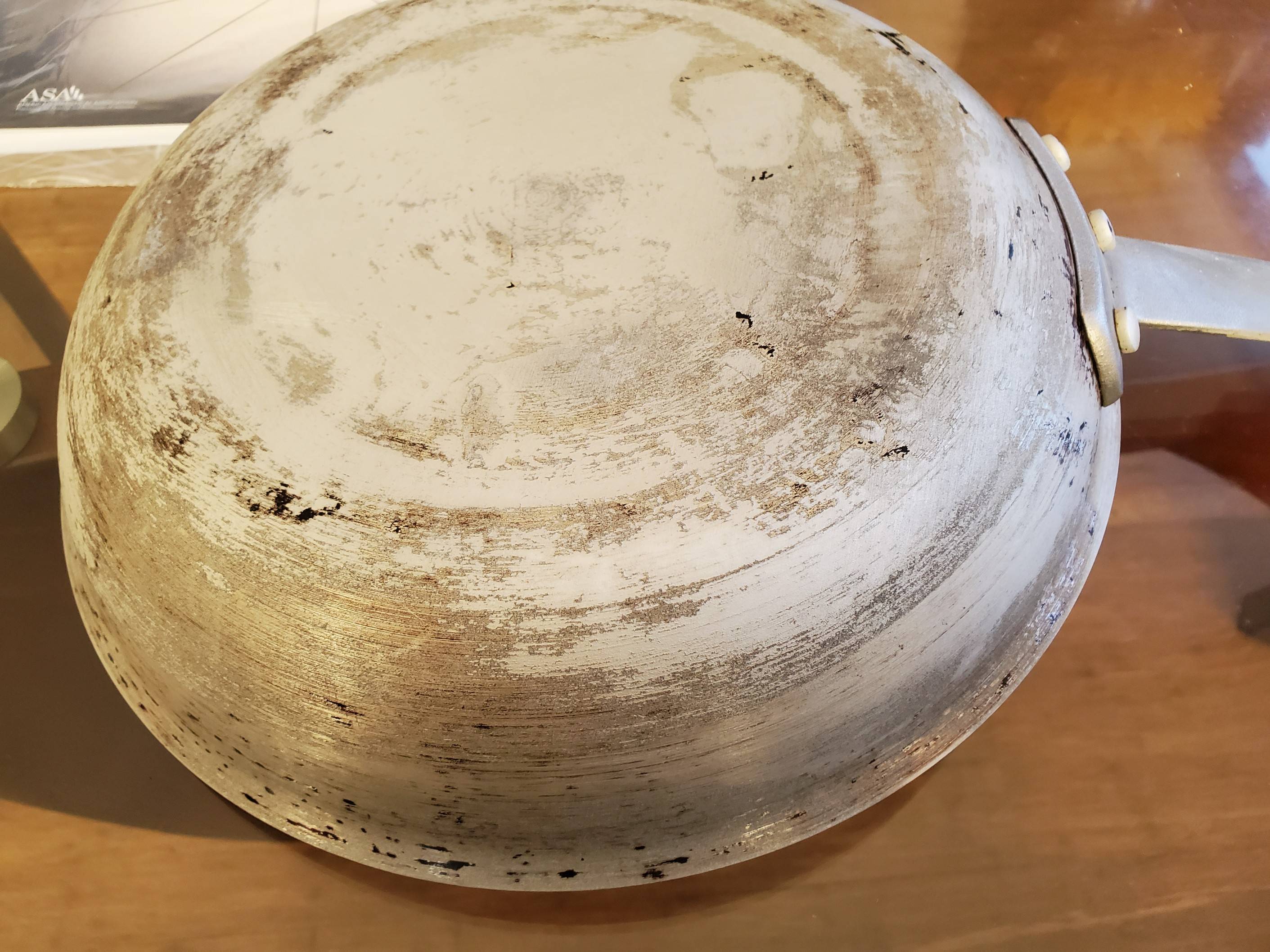 cleaning Damage to pan bottom Seasoned Advice