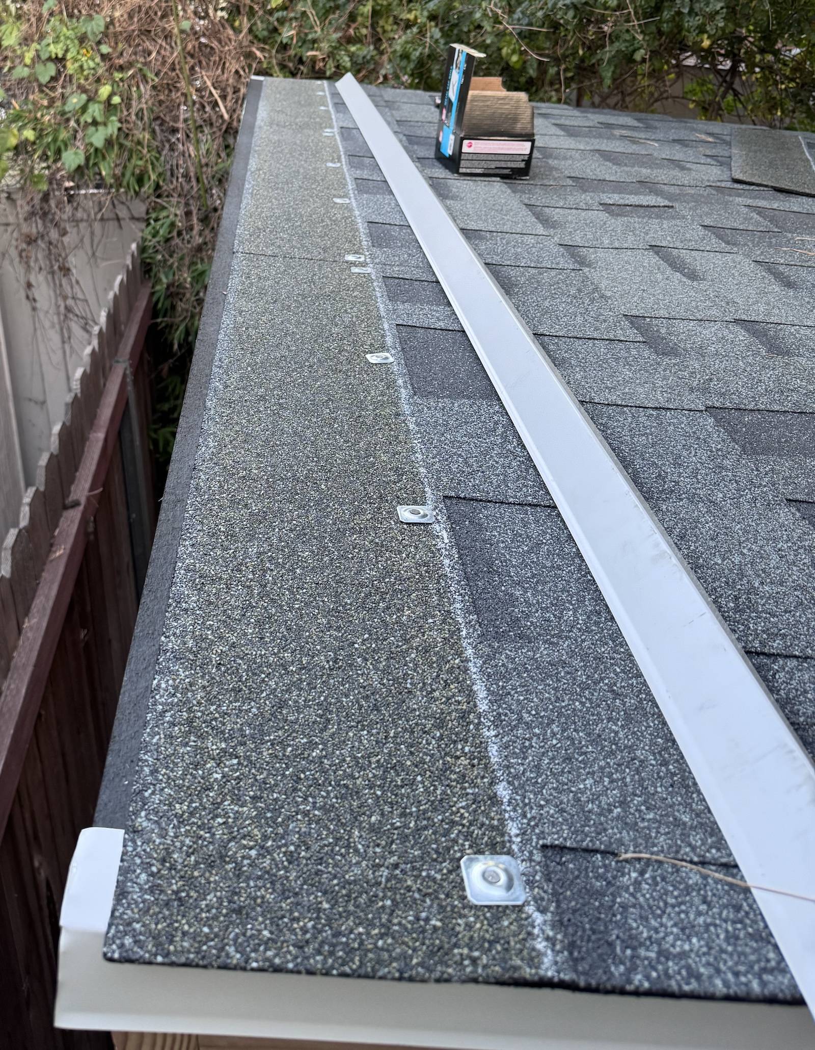 roofing How to finish shingles on leanto roof (top edge, free