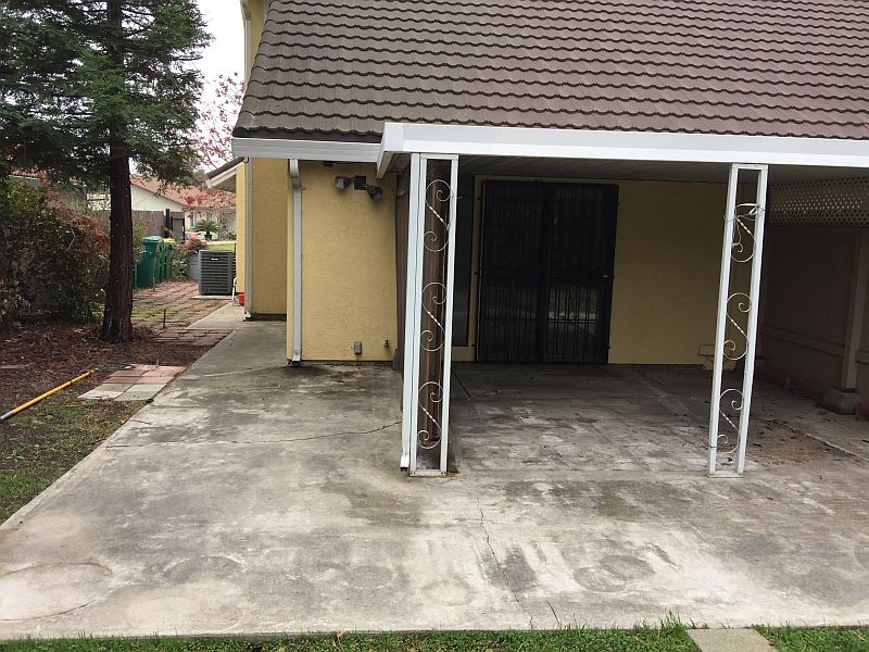 Building Concrete patio against the house with sunken family room for