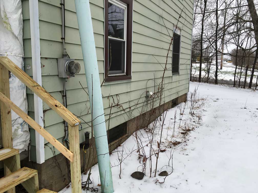 vent What is this green pipe with an open end sticking out of the ground? Home Improvement