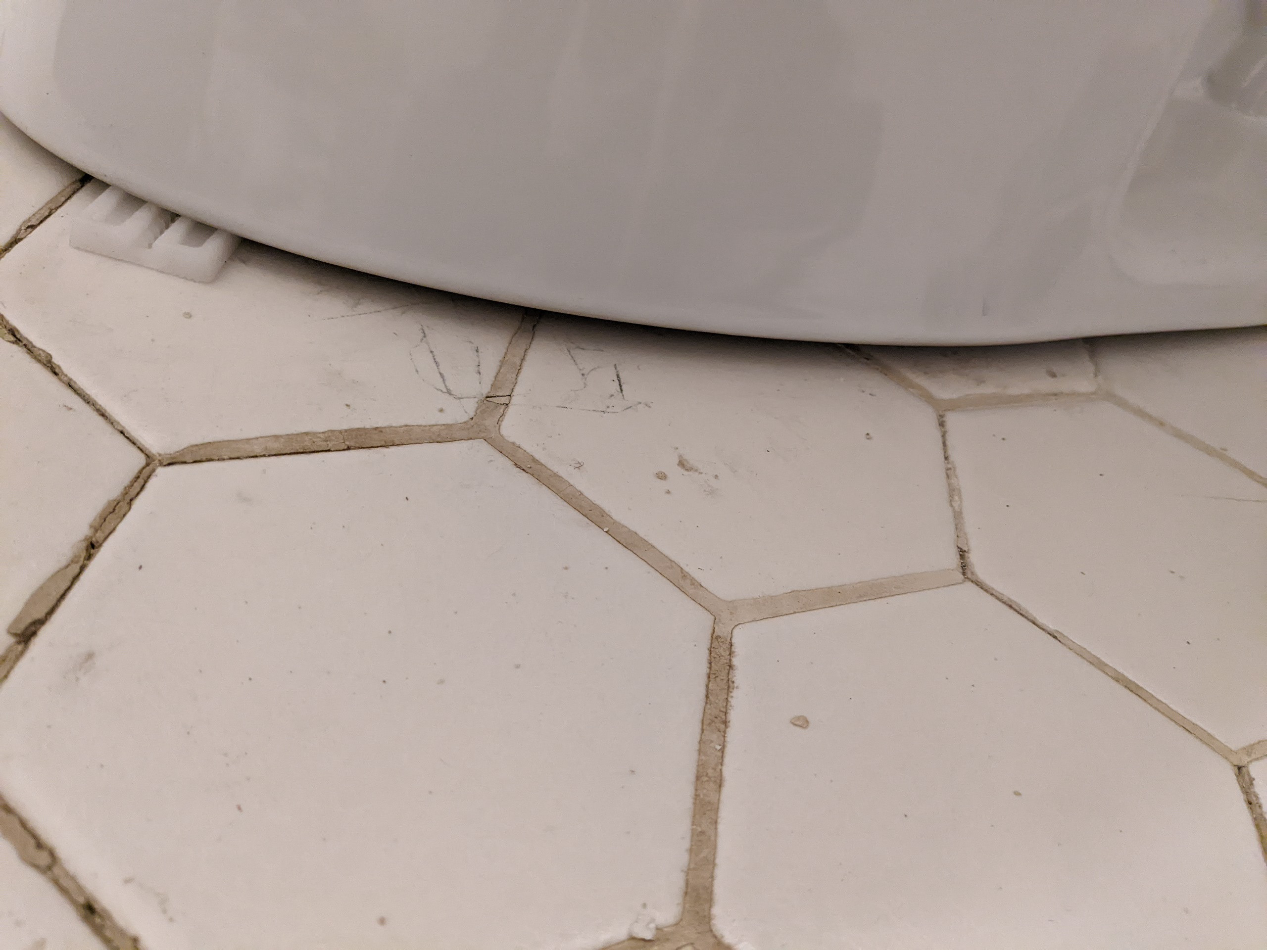 Space under toilet base Home Improvement Stack Exchange