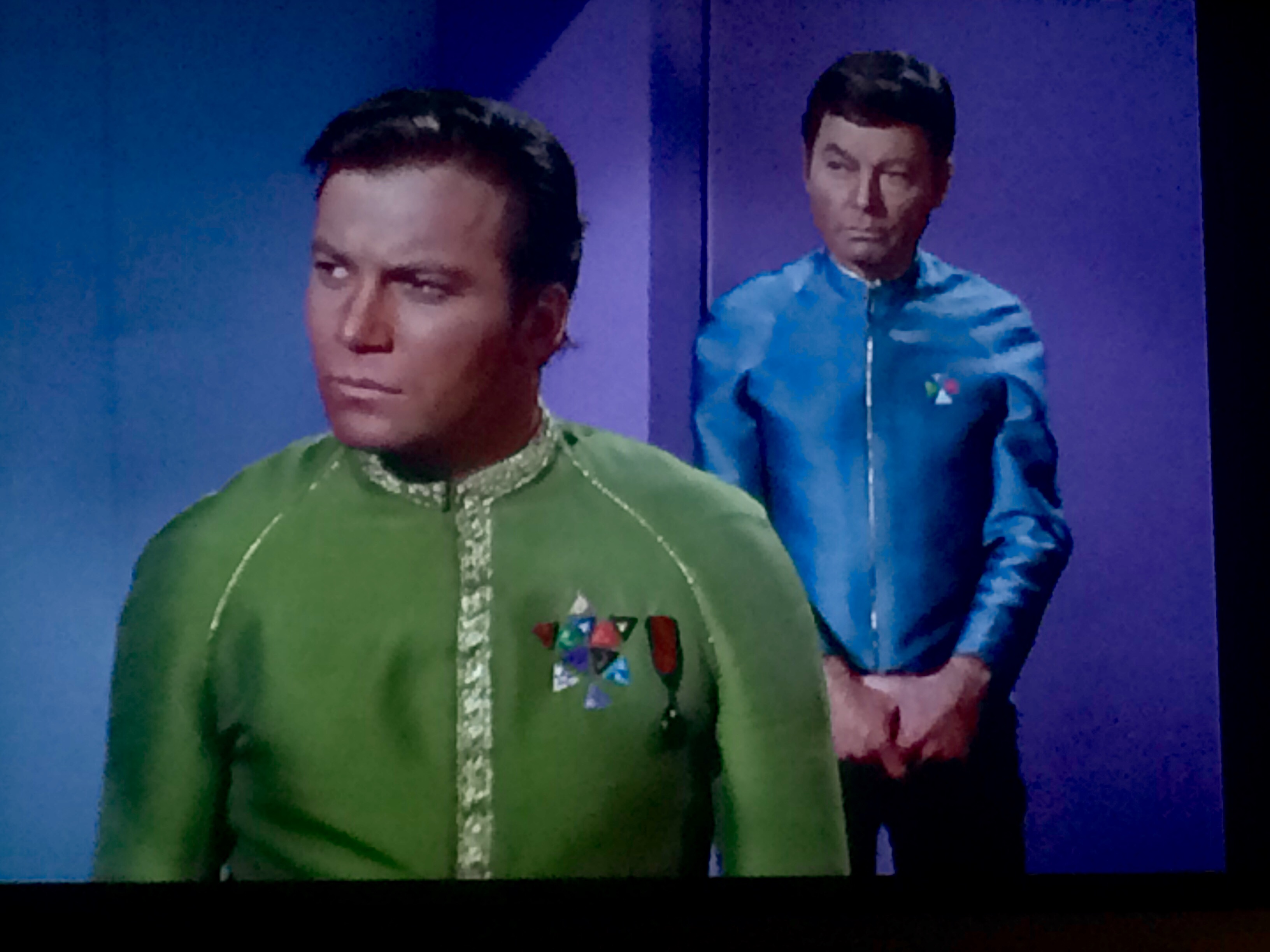 star trek What do the badges on Kirk's dress uniform represent