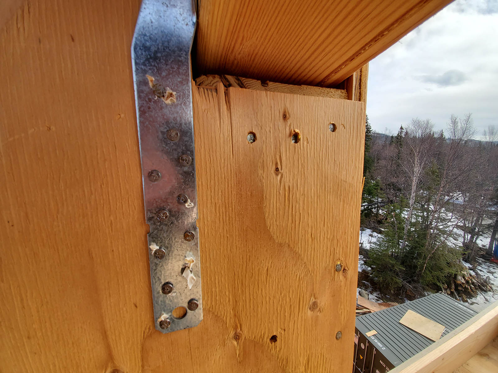 framing Framers installed shear walls, seismic hardware, and the