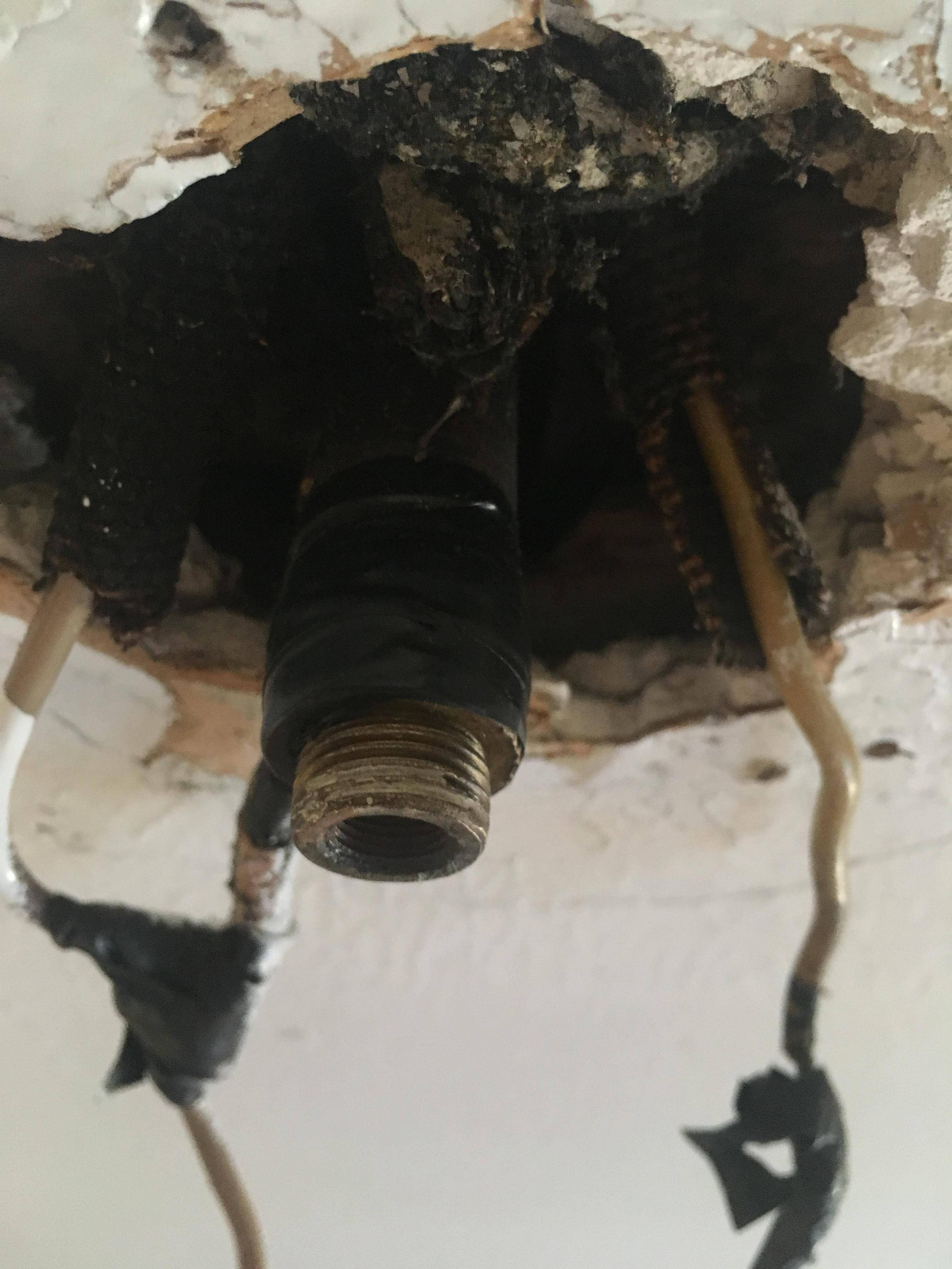 electrical Pipe in ceiling behind old light fixture Home