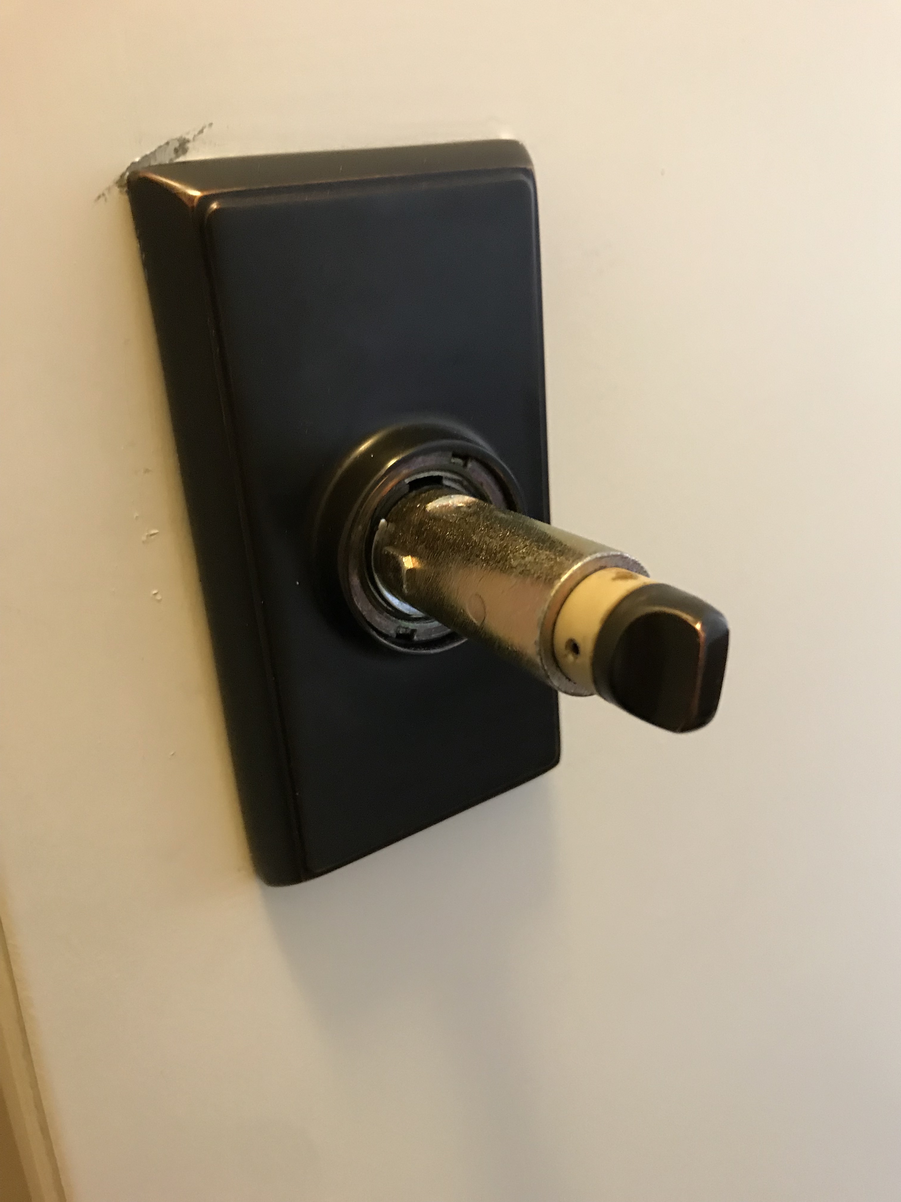 lock How to remove this door knob and plate with no obvious screws
