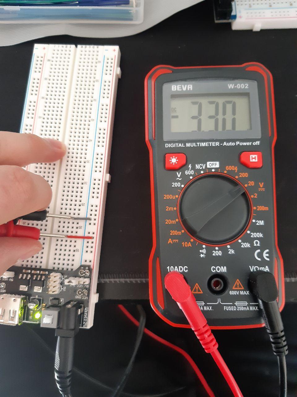 Power supply module on breadboard giving too much voltage