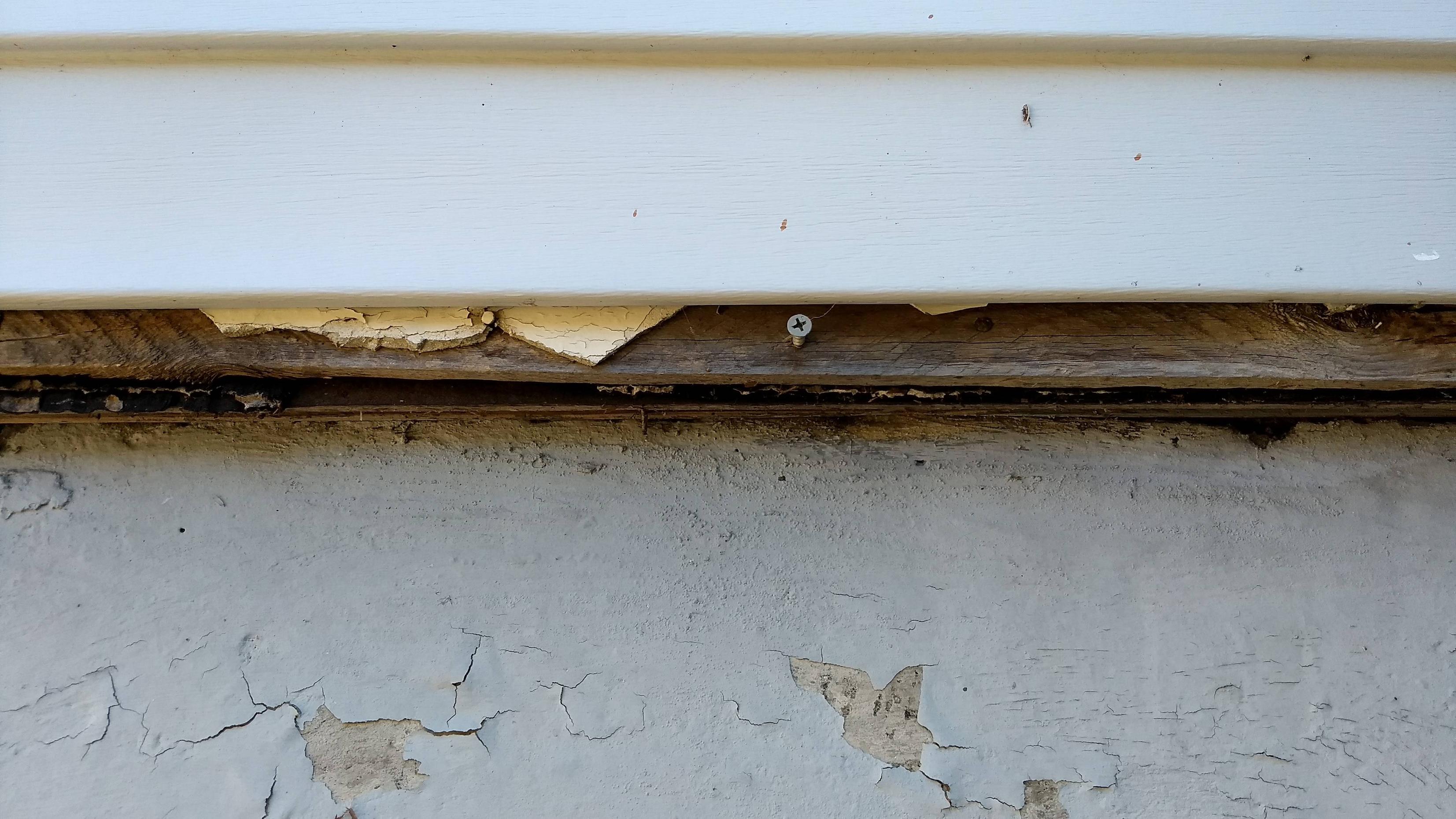 How can I extend existing vinyl siding downward to cover top of