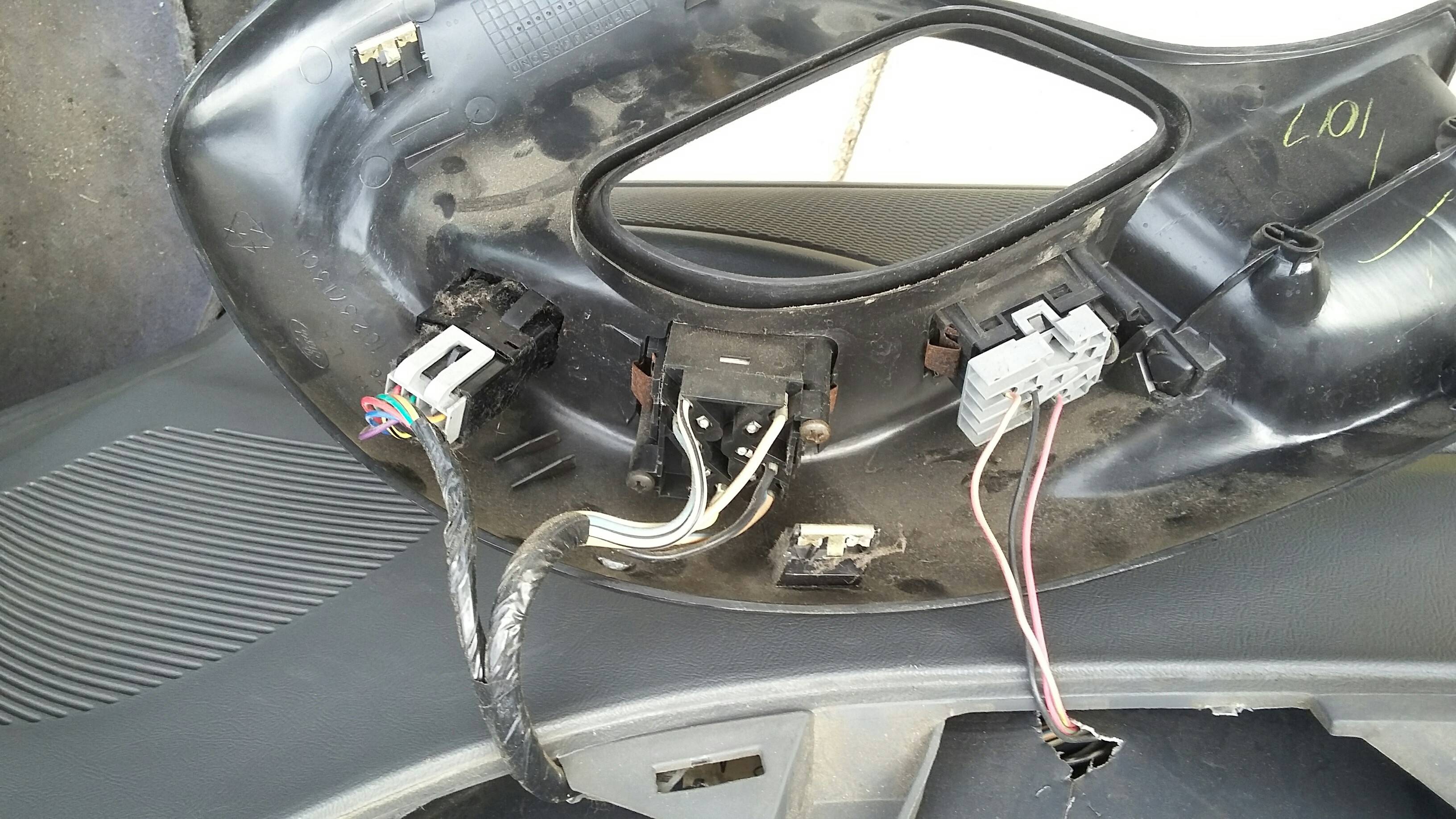 mazda How do I remove these electrical connectors on the inside of my