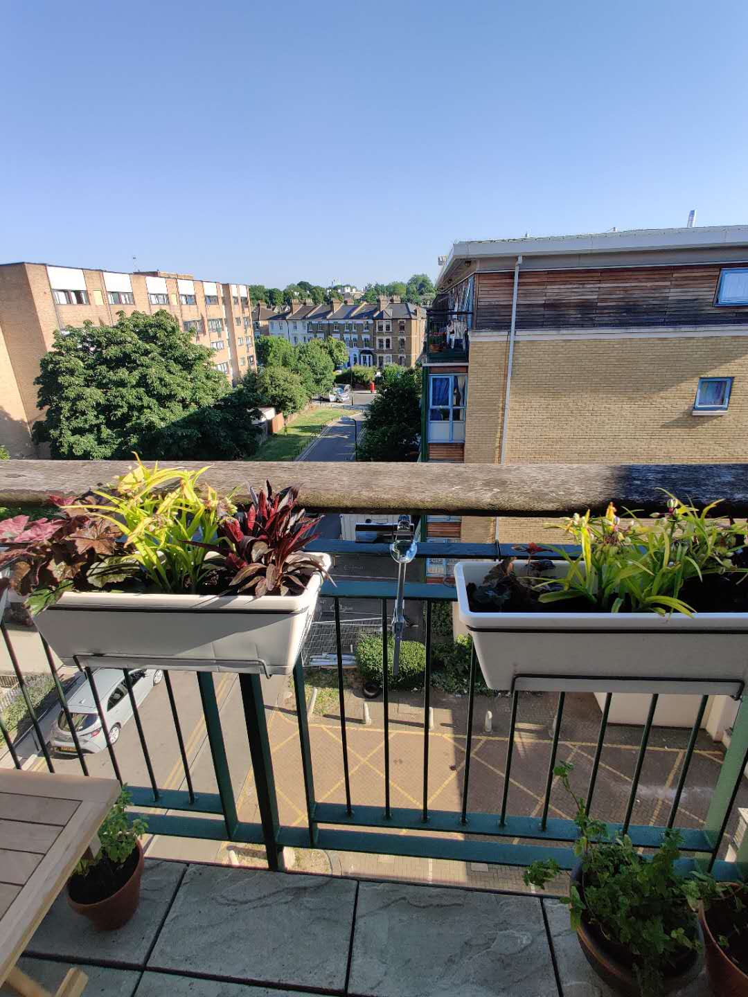 Affixing a sail shade to balcony railing with a pole Love & Improve Life