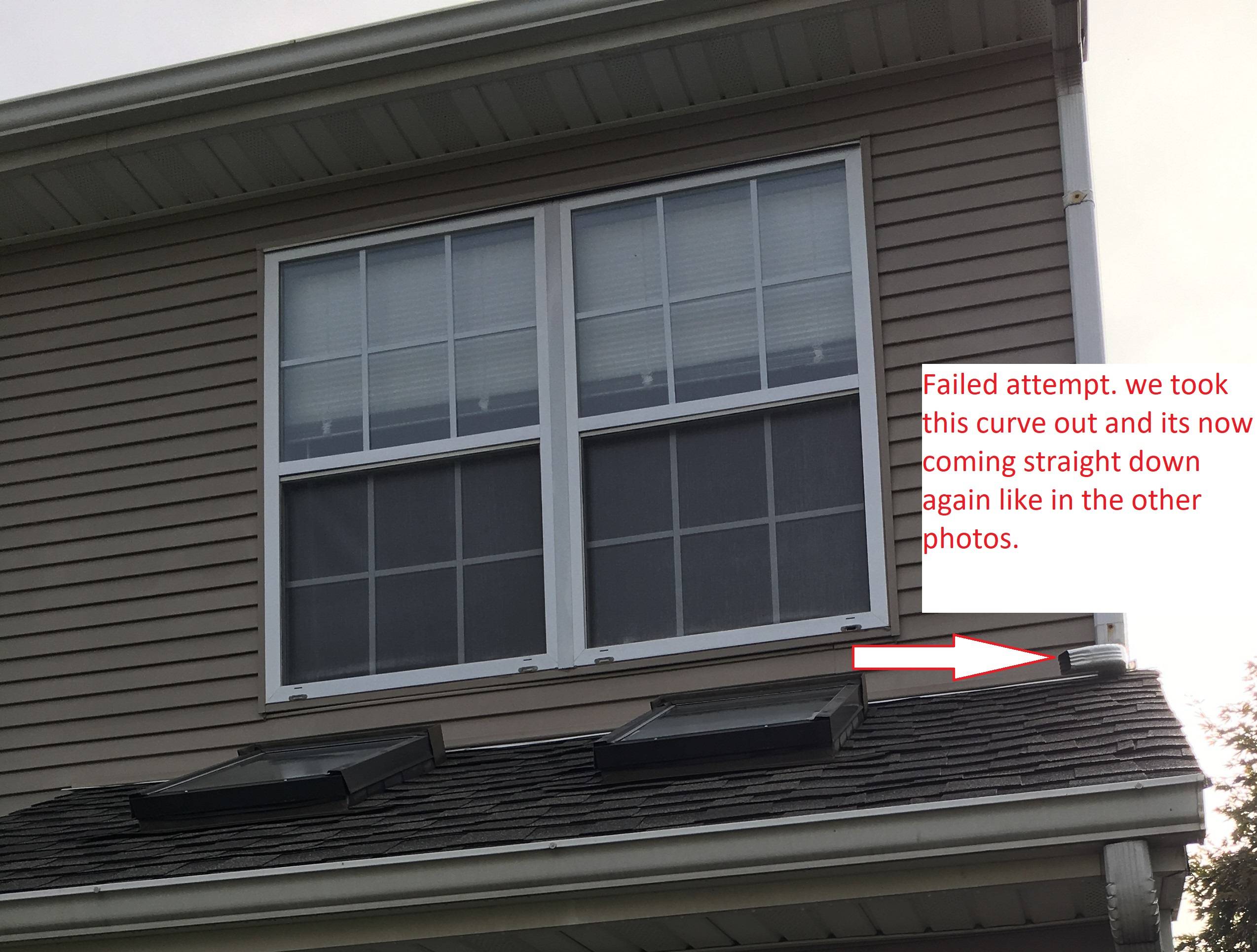 Upper roof downspout emptying onto lower roof Love & Improve Life