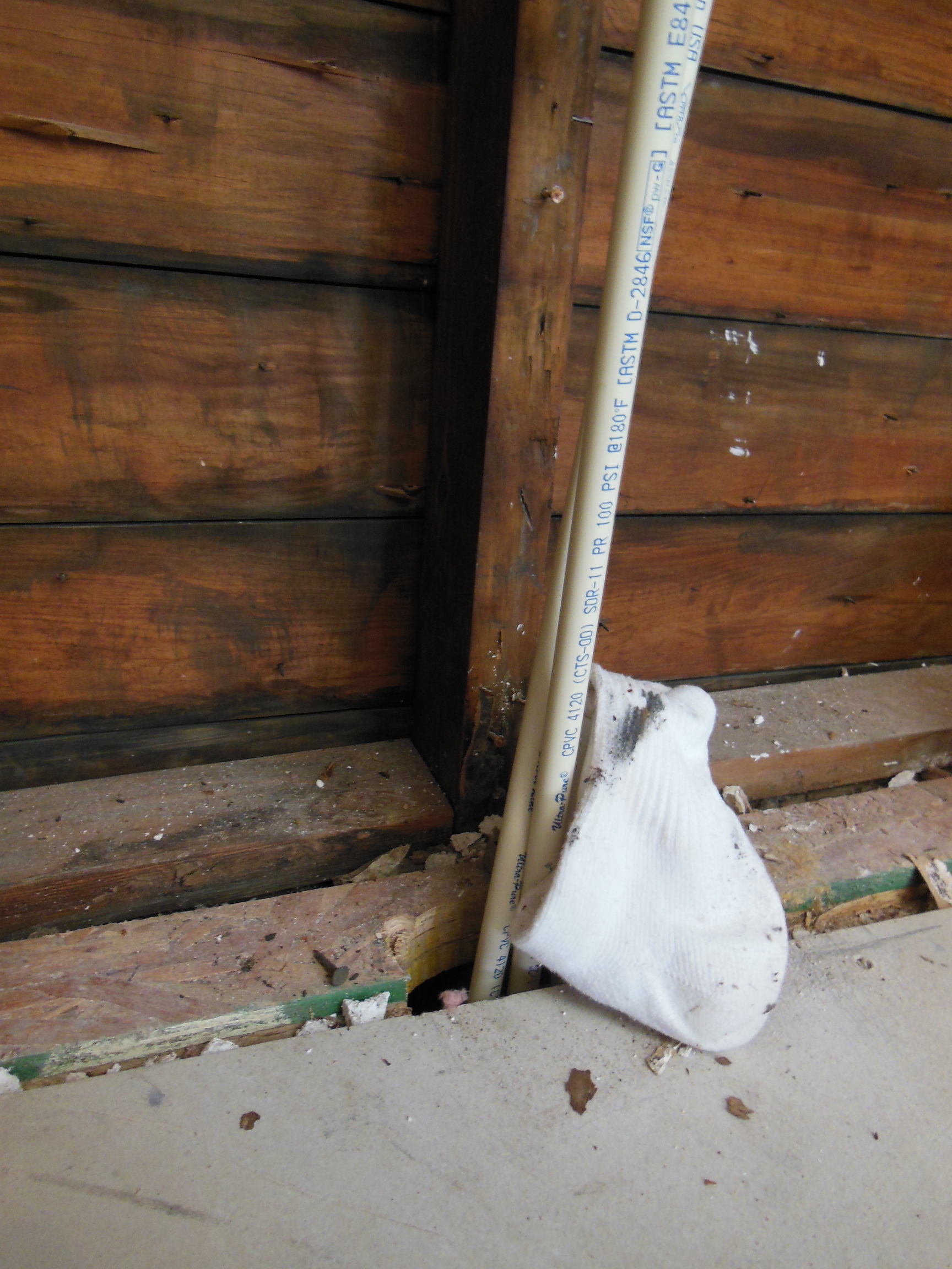 How can I protect this plumbing in an exterior wall from freezing