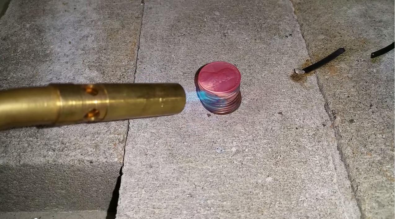 thermodynamics When heat is applied to the top of a stack of pennies