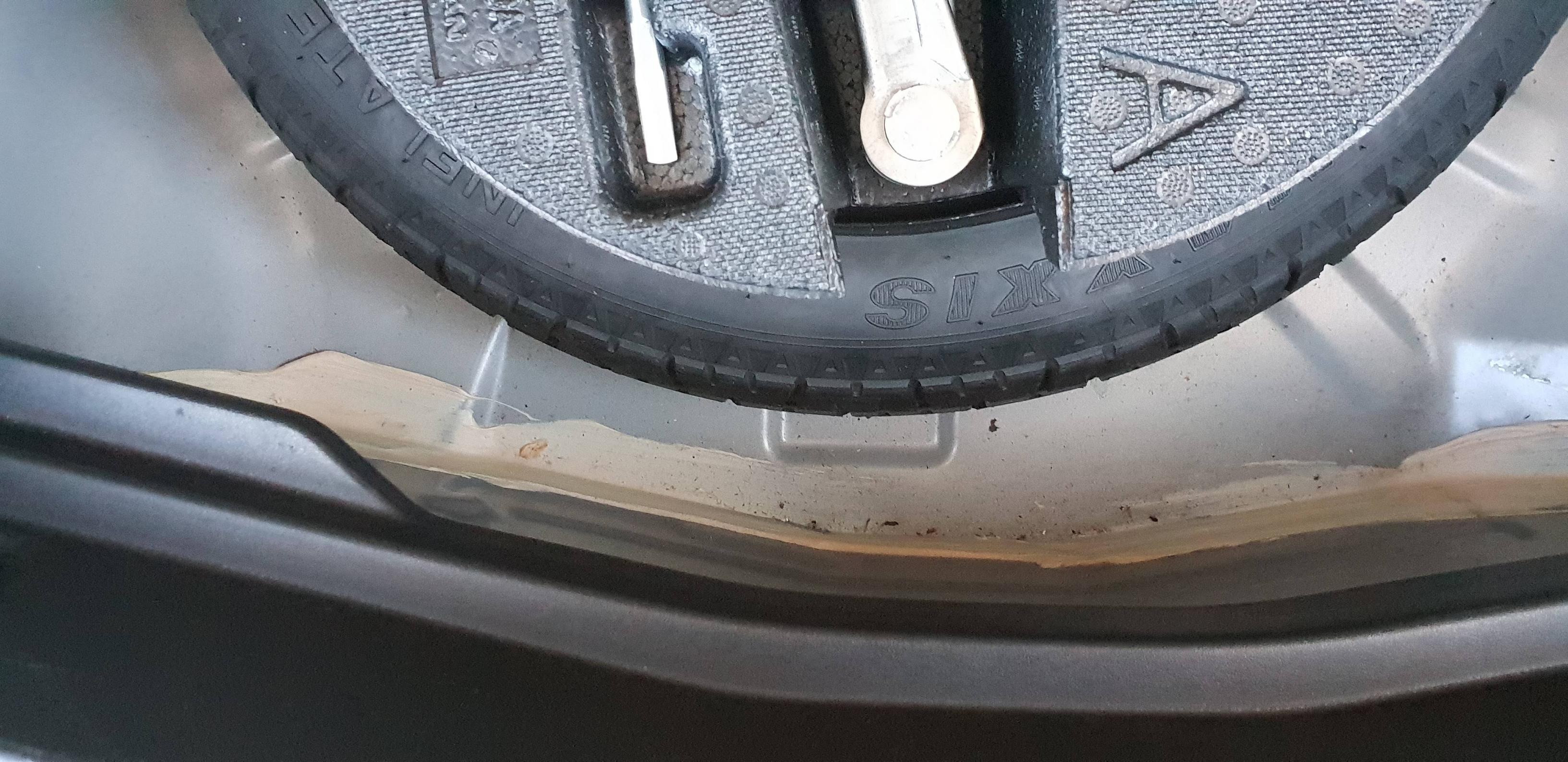 What does it mean if there is “Bondo” under the trunk mat behind the