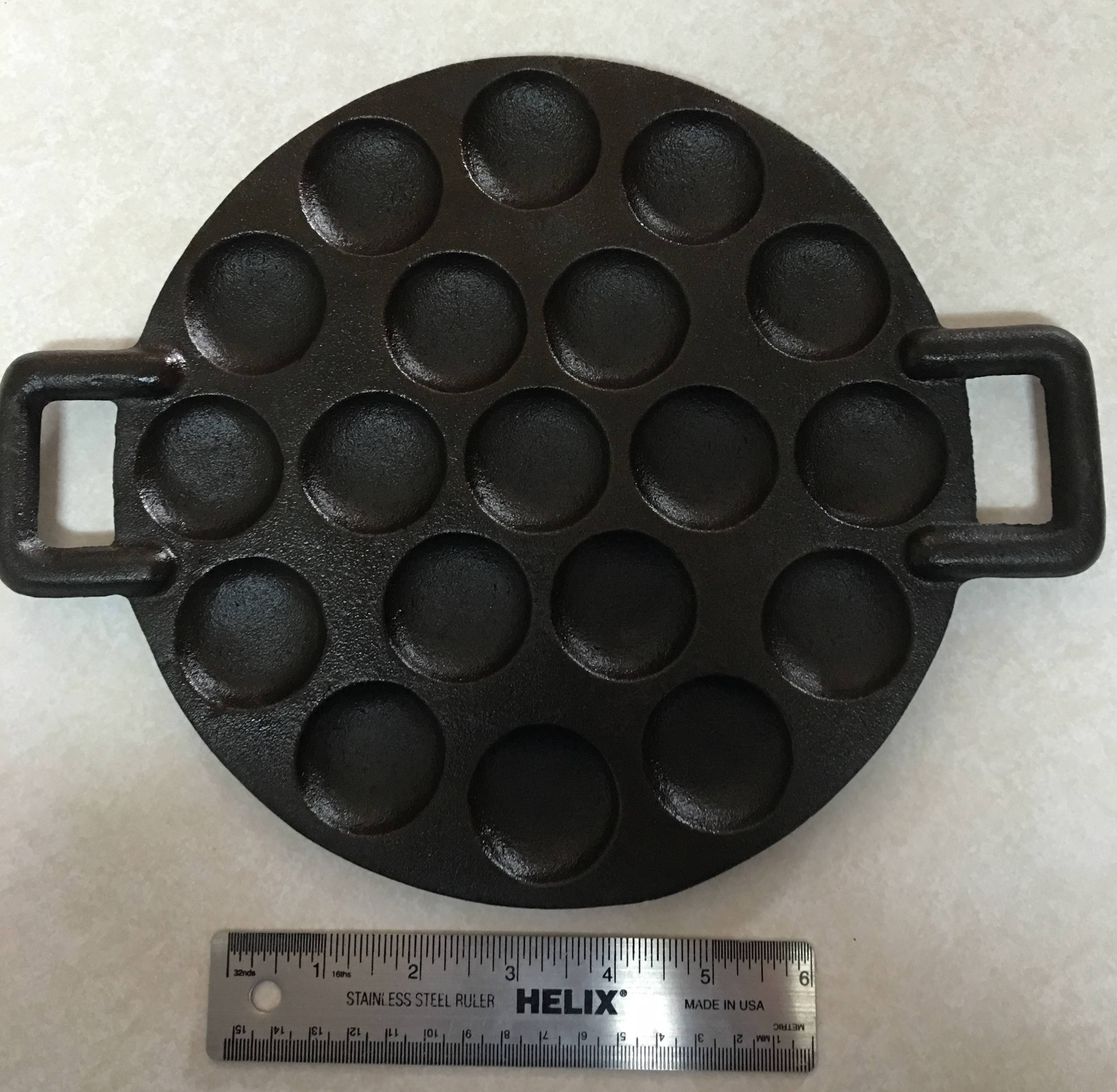 pan What is the function of this shallow, 19divoted, eared cast iron piece? Seasoned Advice