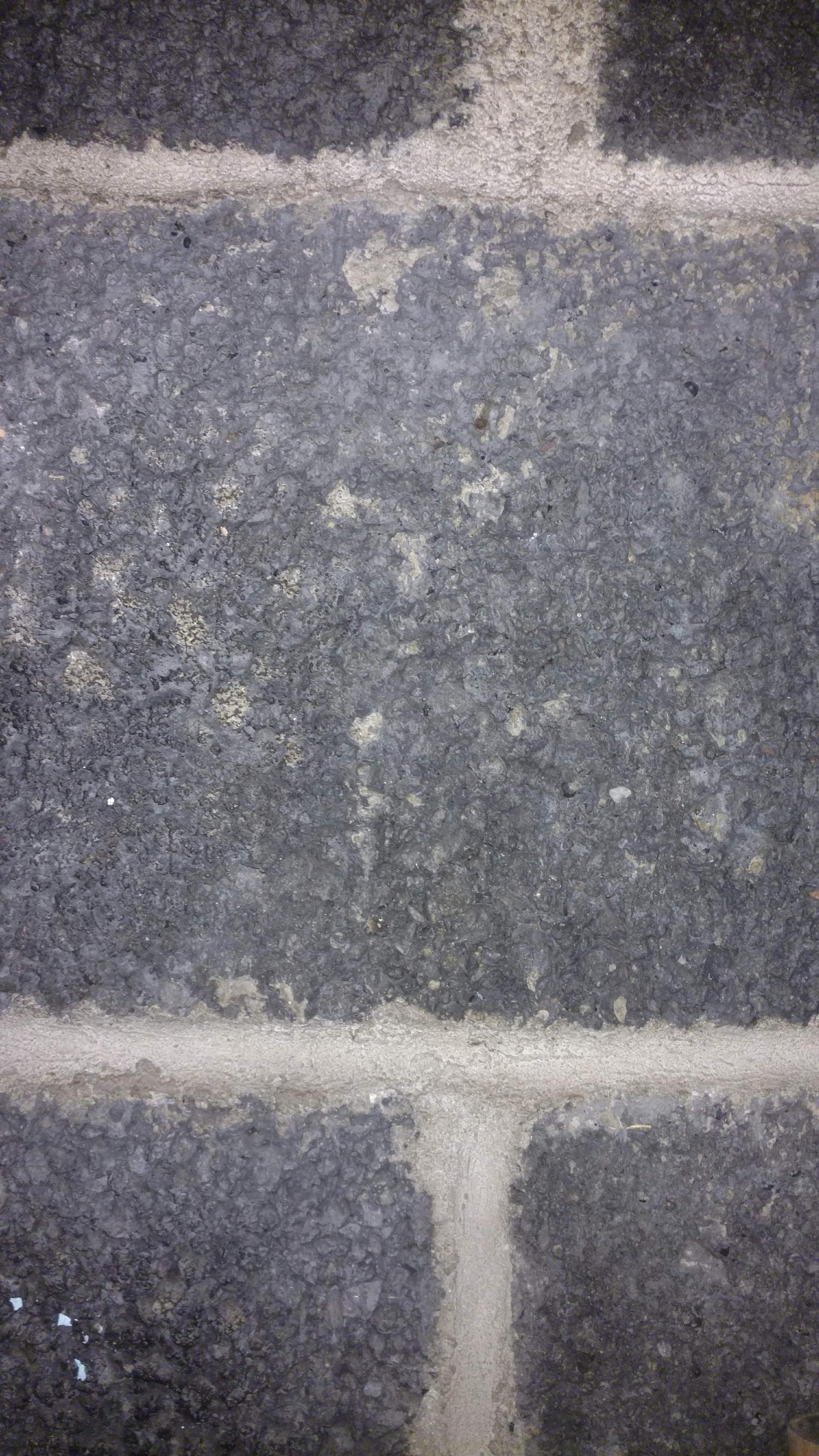 concrete Weird orange rust spots appearing in holes on freshly