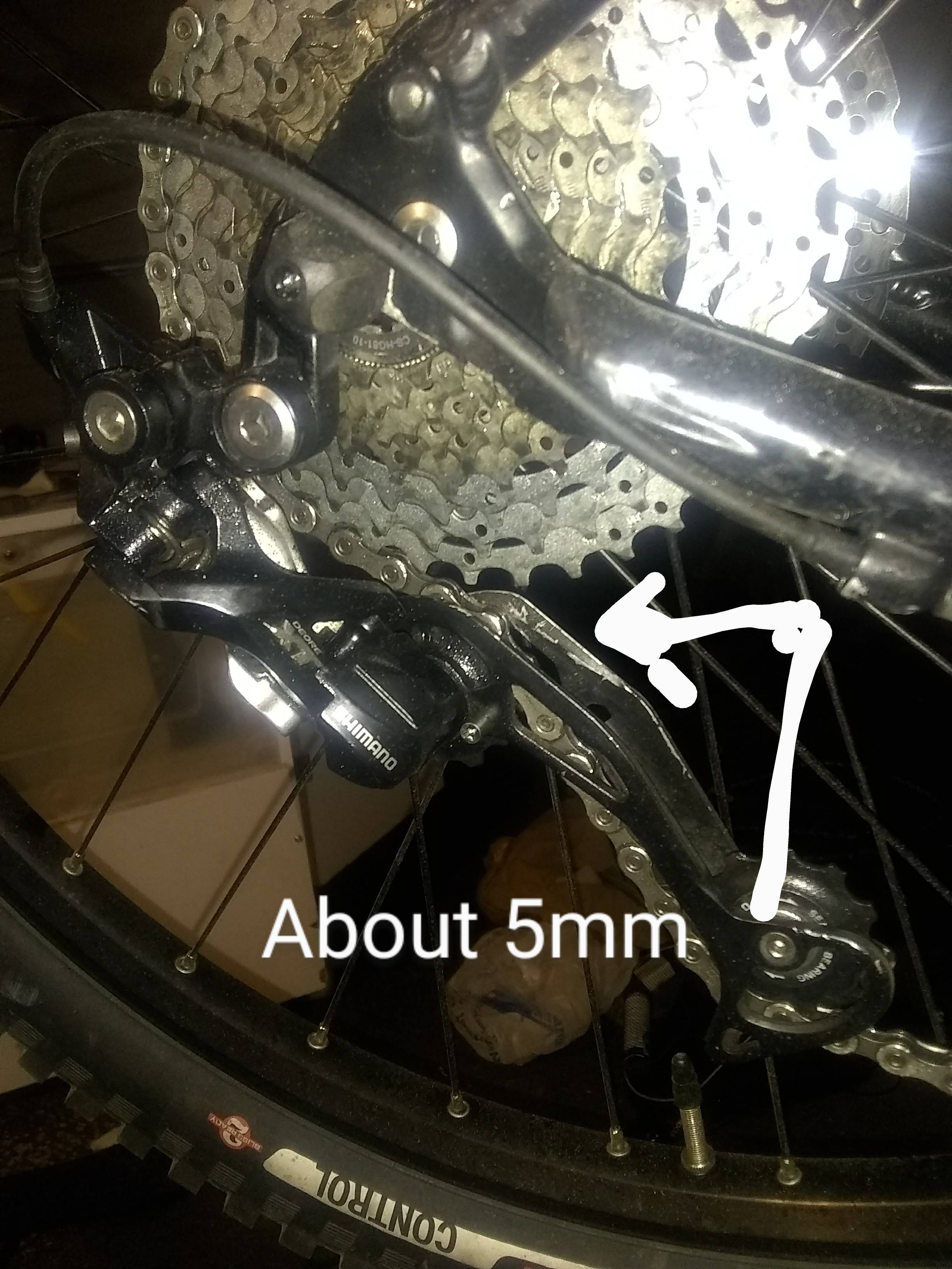 mountain bike Can I reorient my dérailleur so the top jockey doesn't hit the cassette