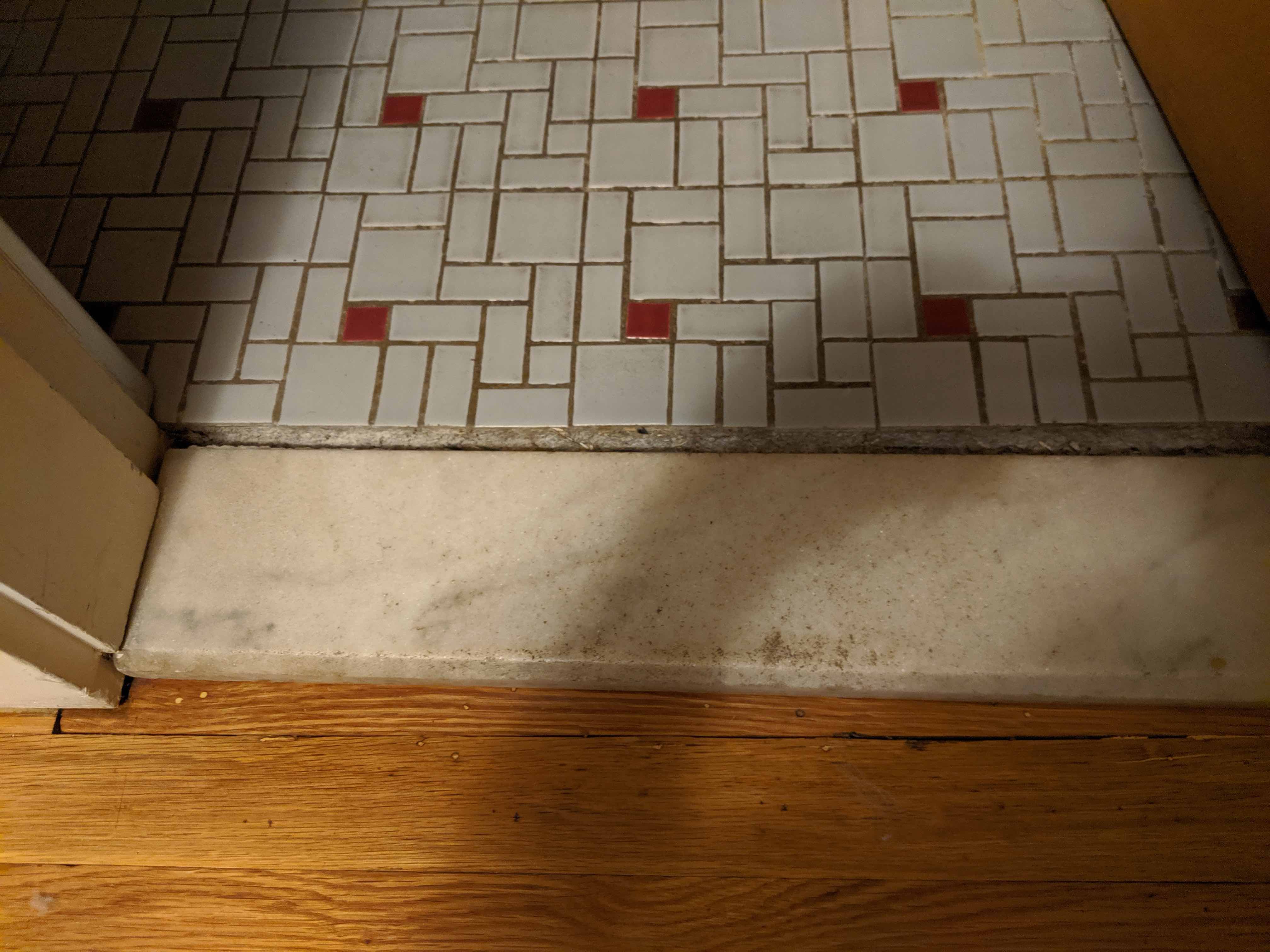 bathroom How should I repair a loose marble door sill? Home