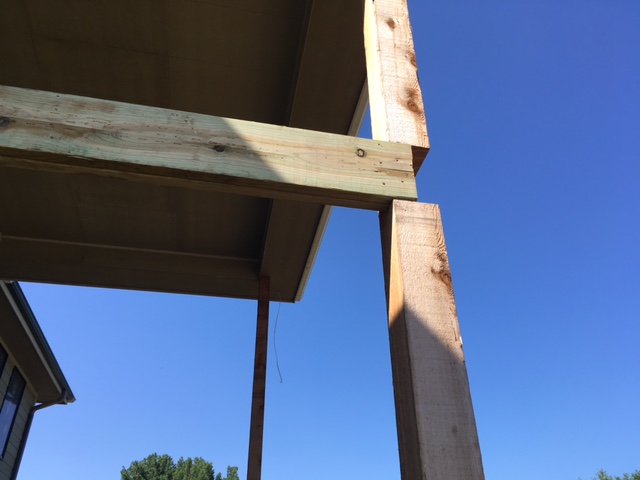 Deeply notched deck post also supporting a roof Home Improvement