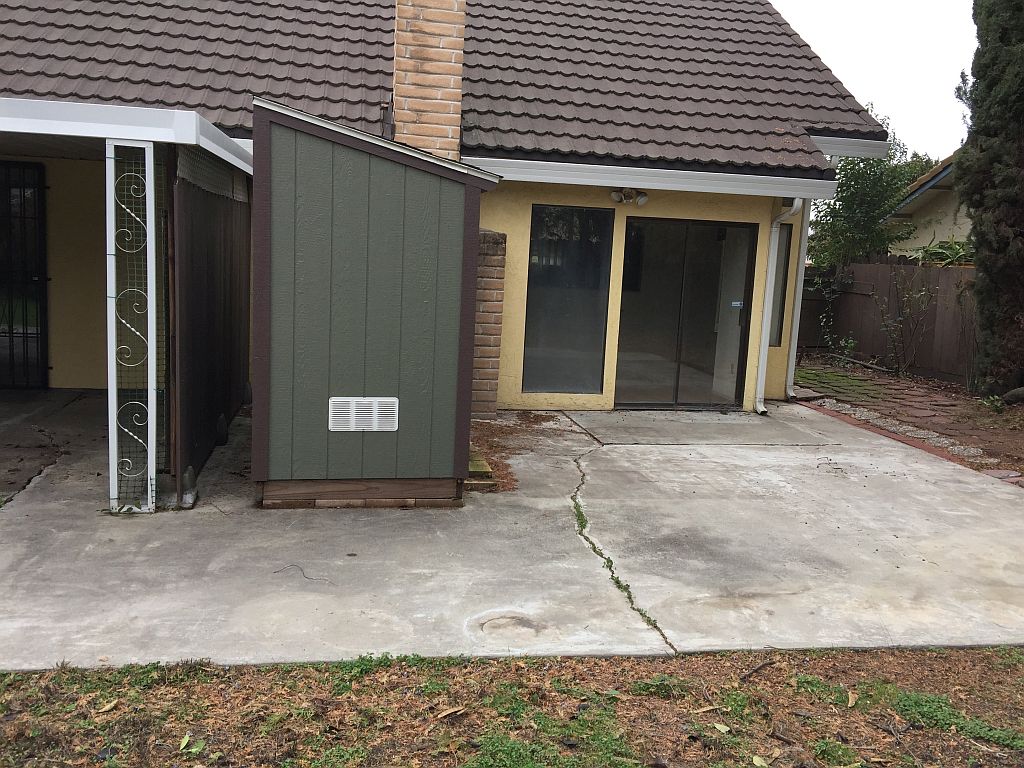 Building Concrete patio against the house with sunken family room for