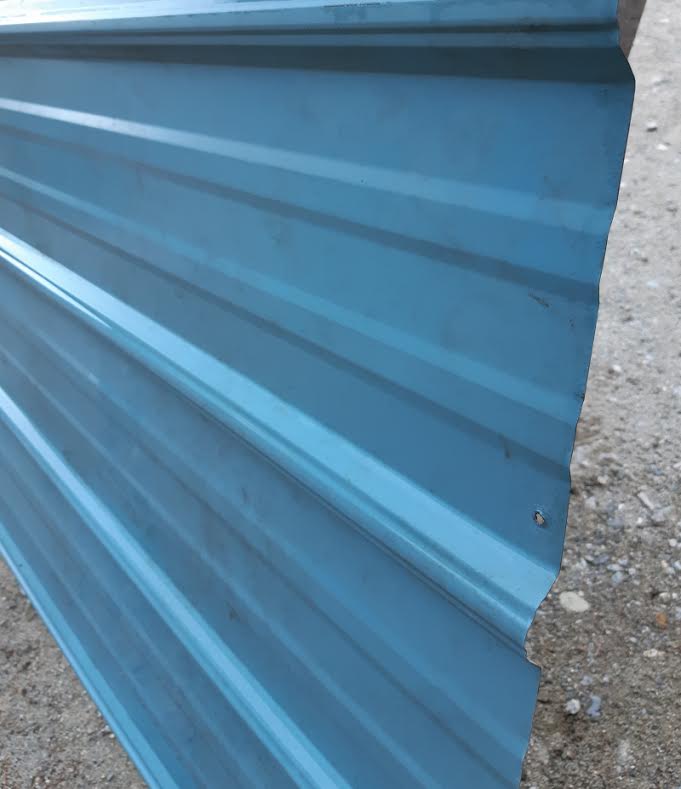 Use corrugated metal roofing panels as soffits and paint them Love