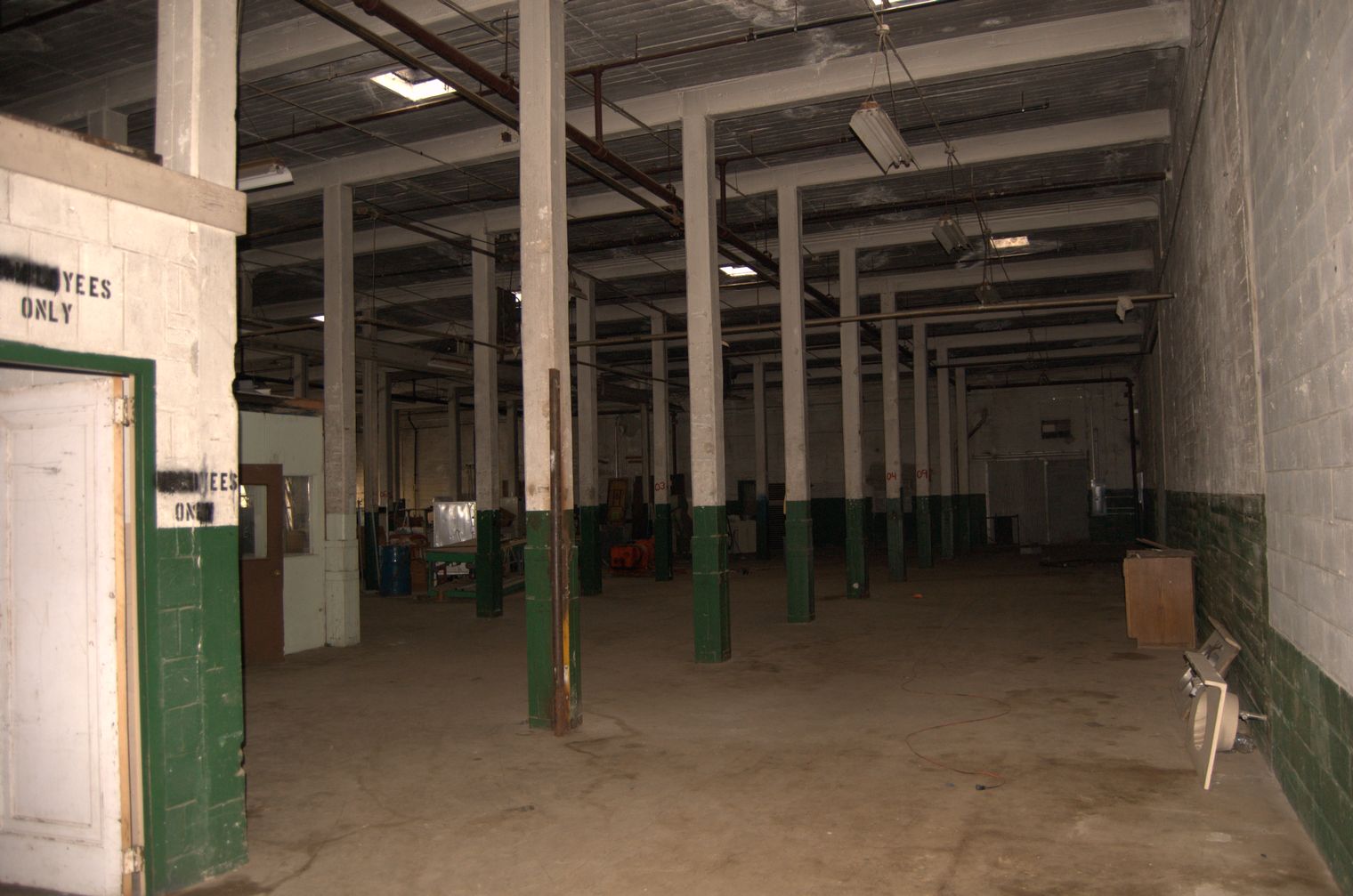 How should I prepare an allconcrete warehouse space before building