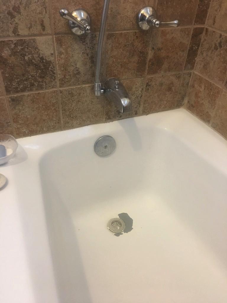 What are the best options to repair this kind of damage in my bathtub