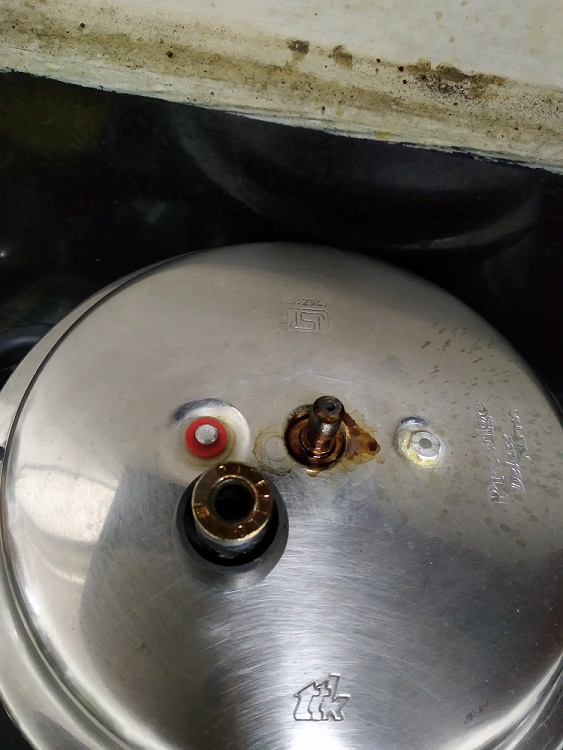 rice Pressure Cooker bottom and whistle got burned while cooking