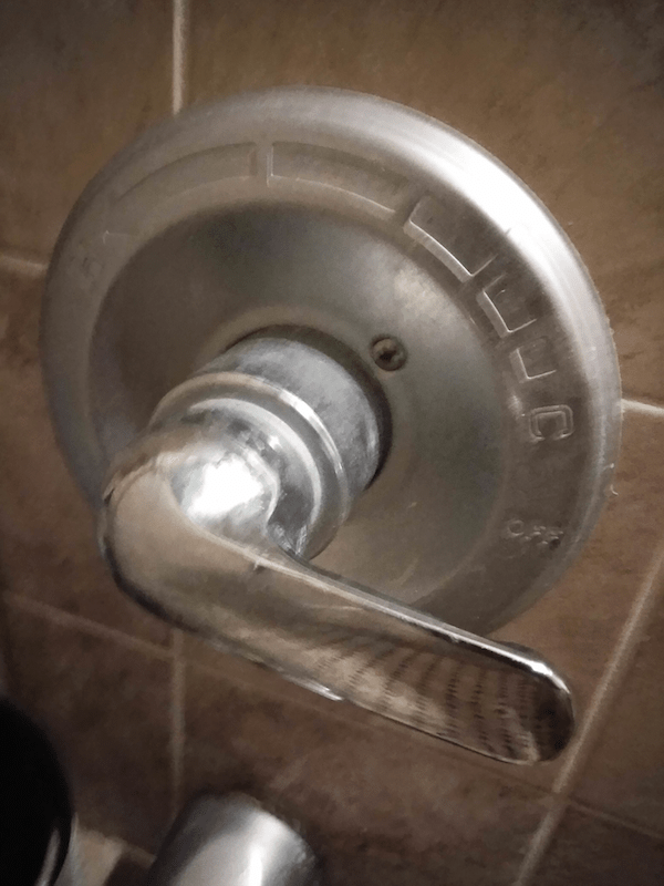 This shower valve doesn't seem to have a set screw and i need to take it off Home Improvement