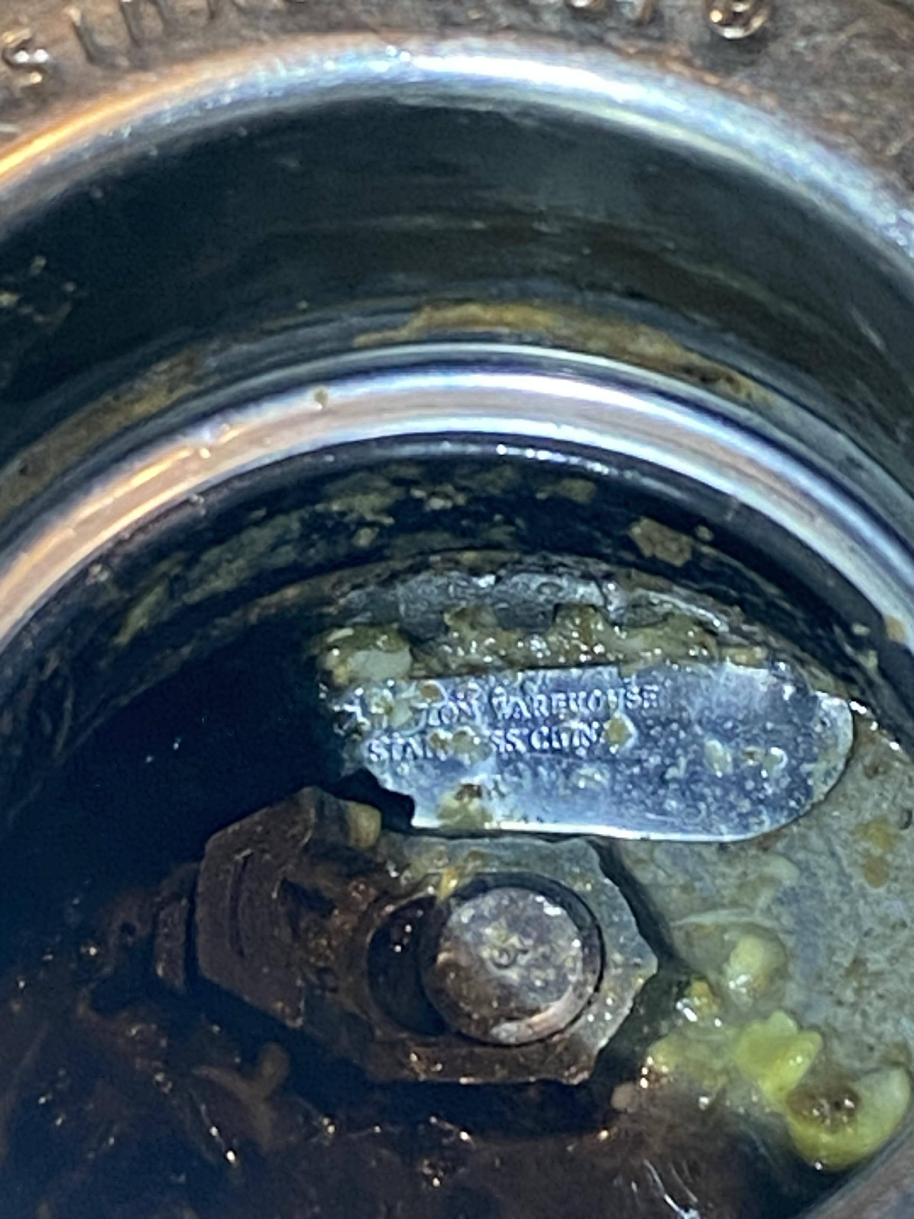 How can I remove a broken knife blade stuck in my sink disposal? Home