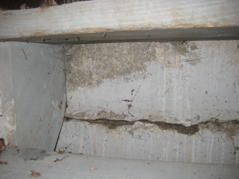 concrete How can I stop water from coming in through a crack near the