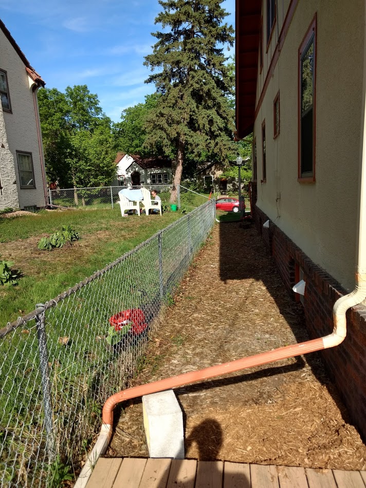 landscaping Grading over asphalt and concrete walkway Home