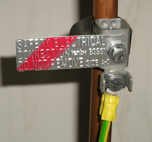 electrical Why is there a copper wire attached to this water pipe