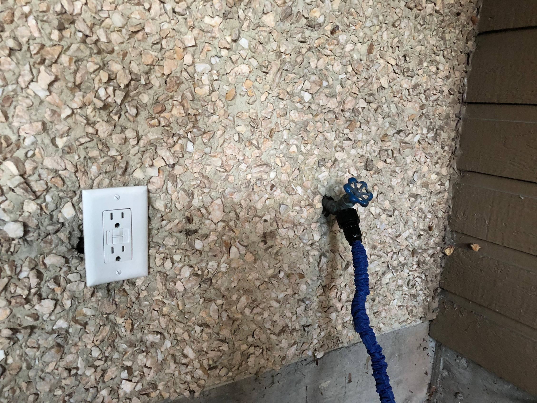 electrical How can I protect this exterior outlet from water and