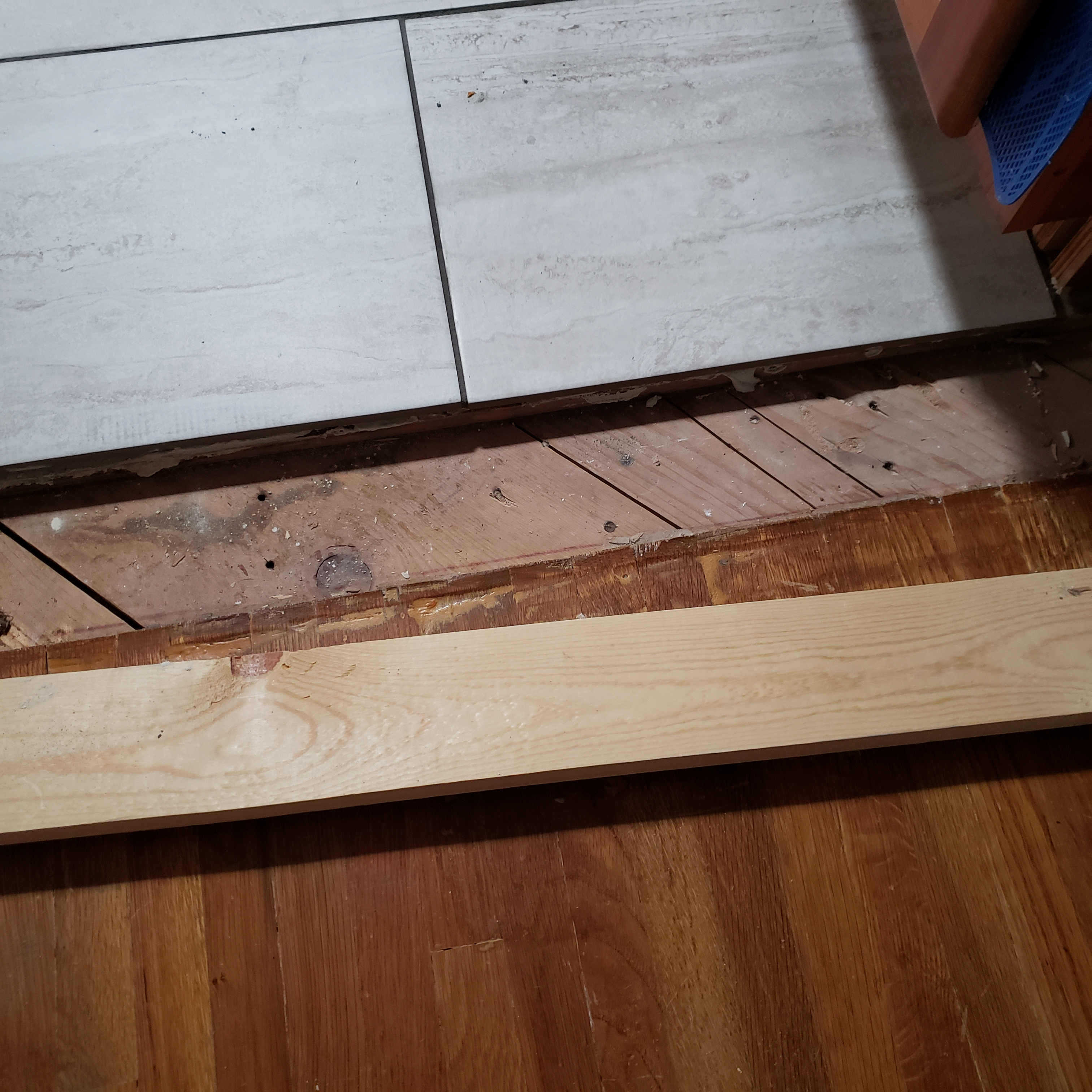 What is the best way to bridge a huge gap between hardwood and tile