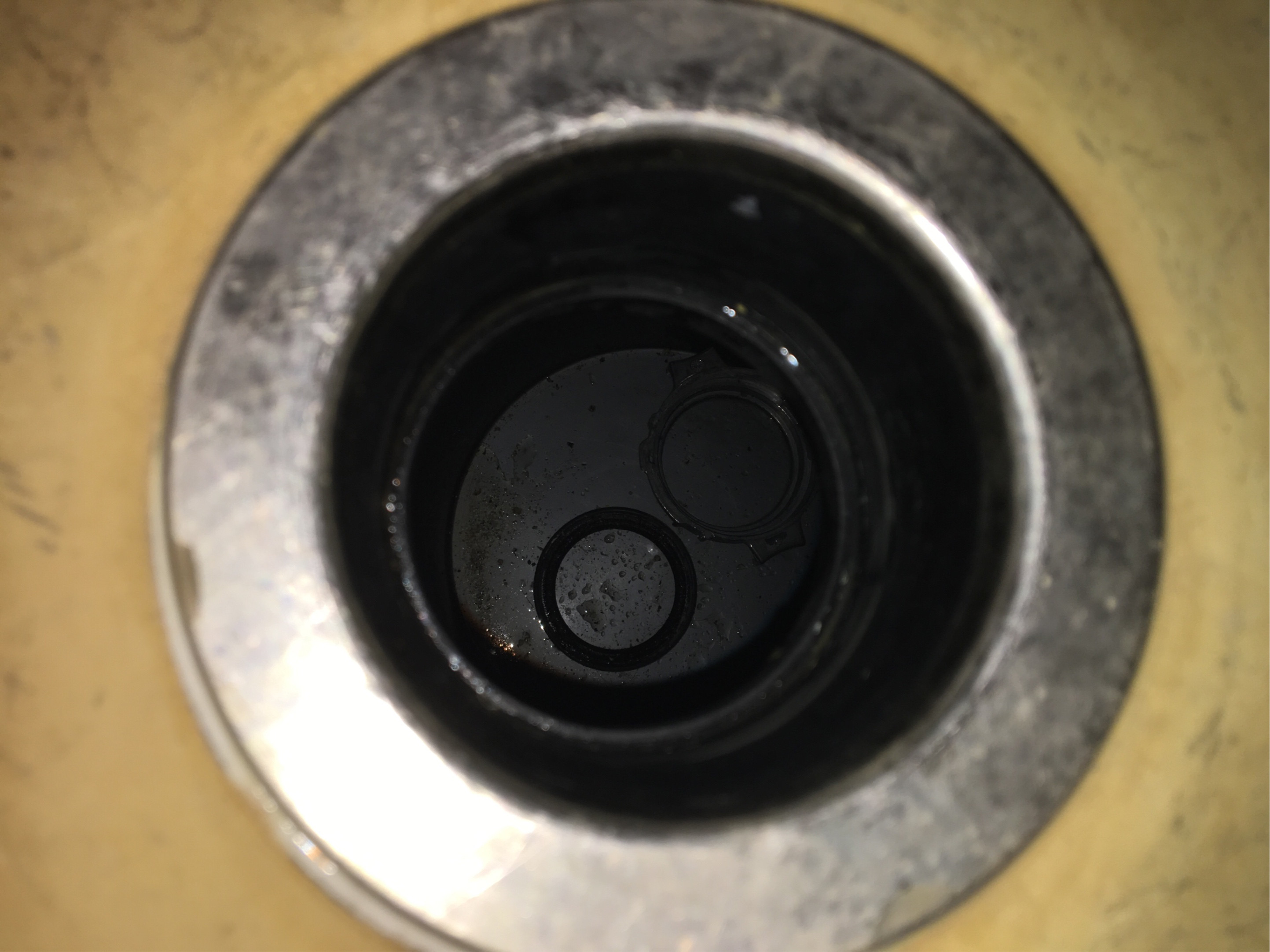 garbage disposal Unscrew jammed plastic screw of sink basket assembly