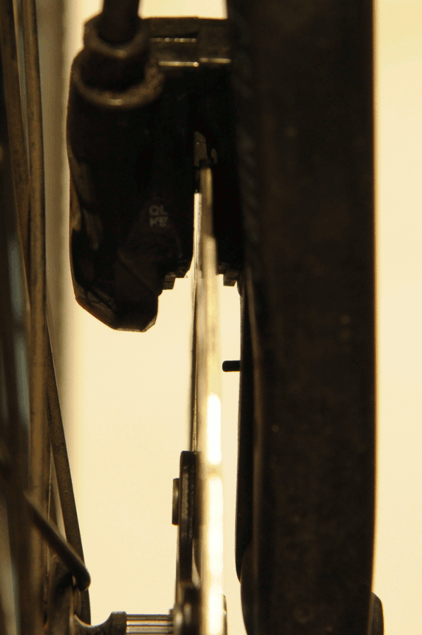 damage Front disc brake wobbling / grinding on pads after full