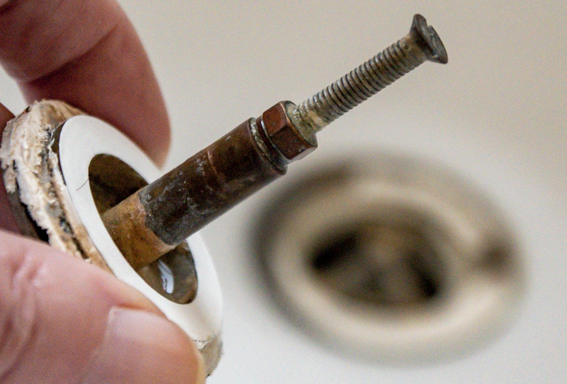 bathtub Tub drains slowly unless I hold down the lever Home