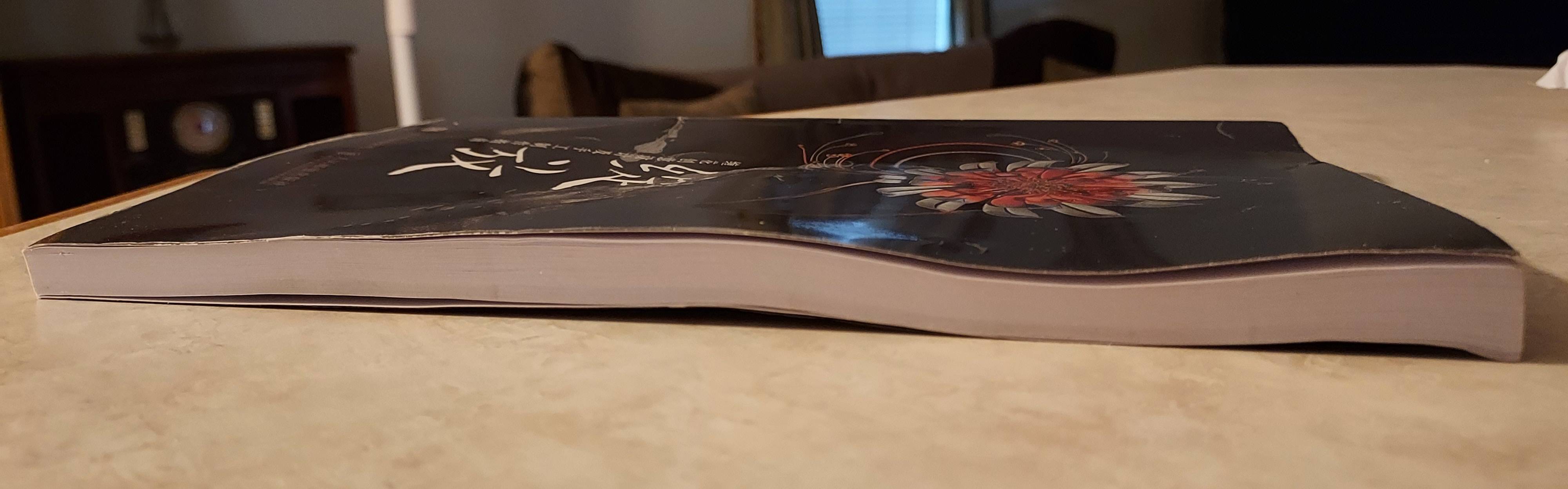 physical books How do I repair warping, creasing, and lamination